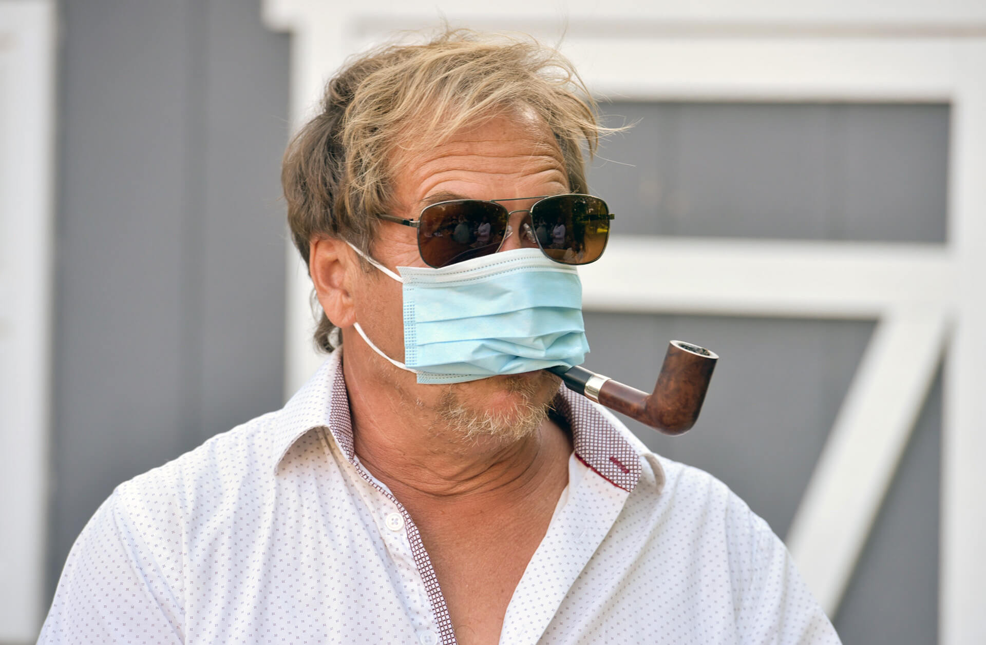 A guest tries (sort of ) to mask up during a wedding in Michigan during the pandemic.