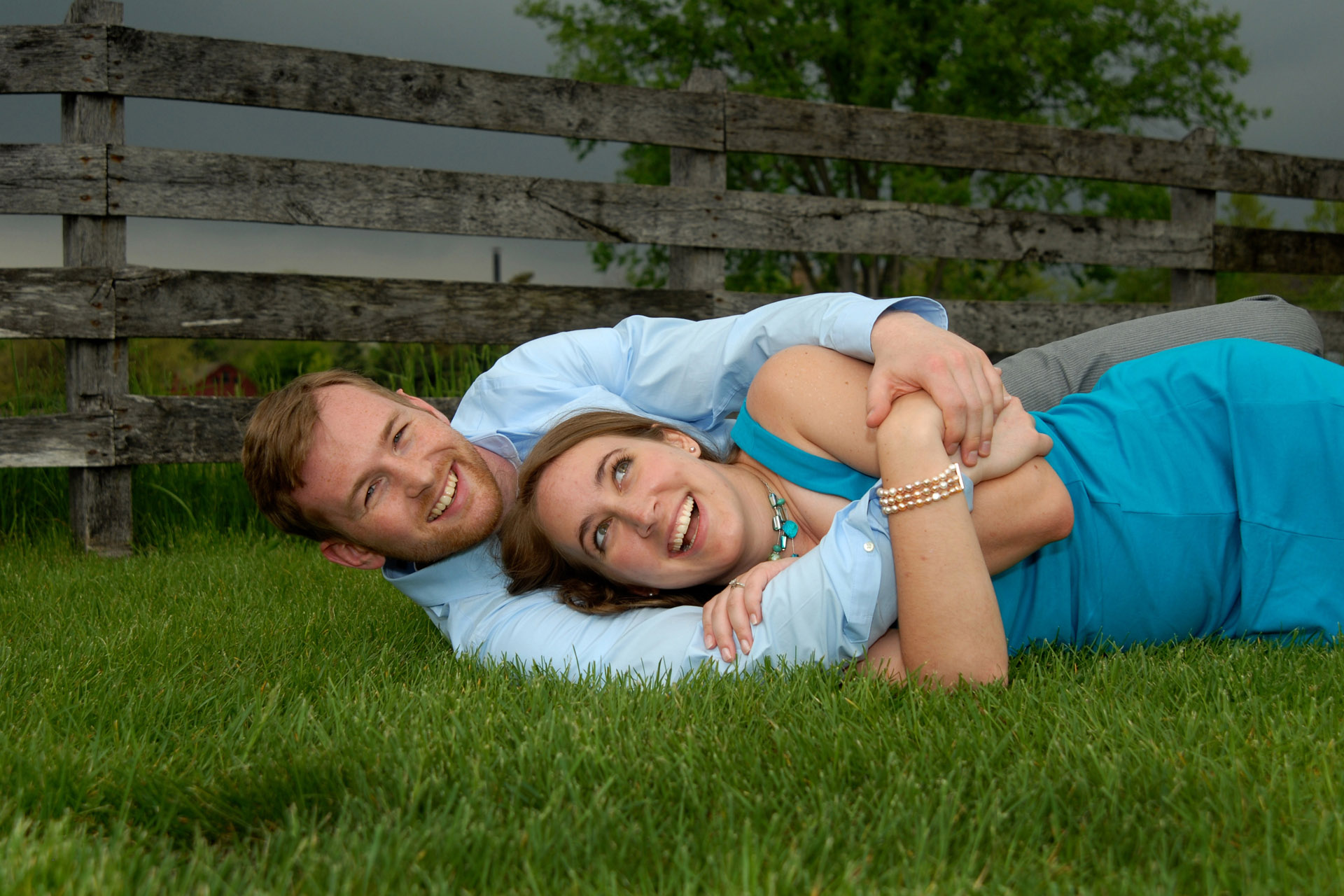 Classic engagement portraits and lifestyle candid engagement photography in metro Detroit, Michigan like this couple cuddling just before a major storm erupts.
