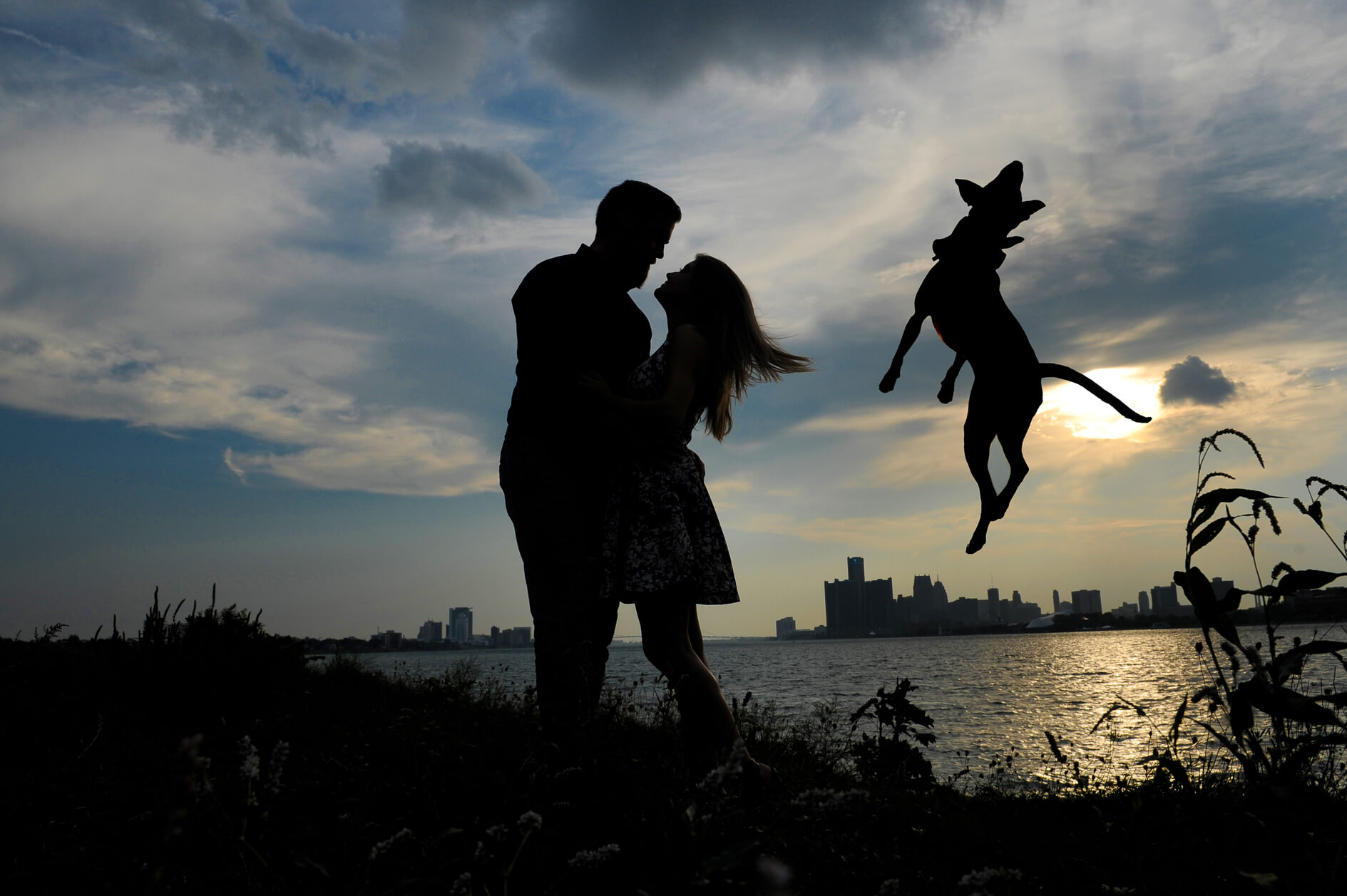 Hilarious engagement photo in Detroit to showcase their amazing personality like this fun shot of a couple out of Belle Isle door their unique location engagement photography session in Detroit, Michigan.