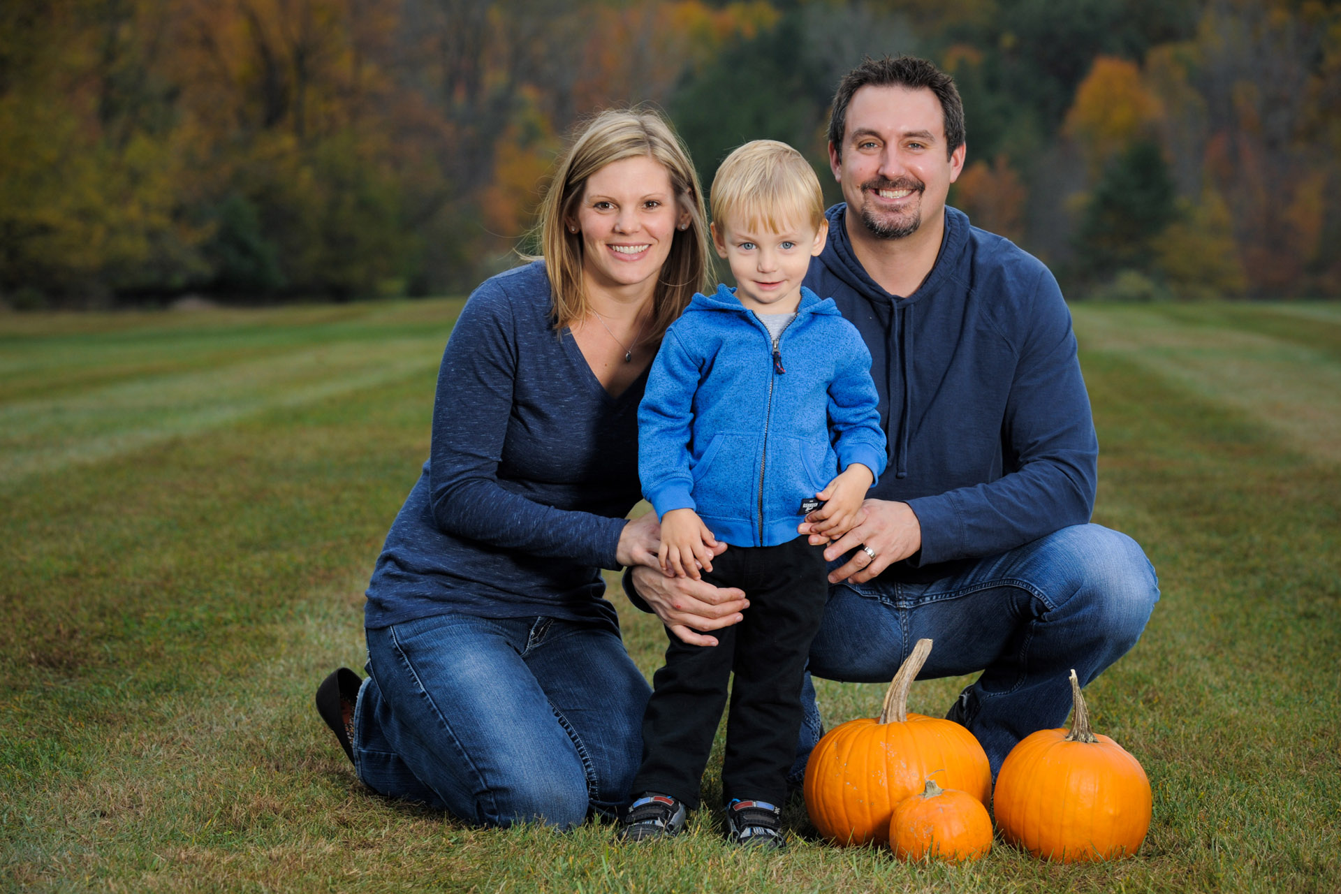 Best Detroit family photographer usually has a lot of family photography sessions in the fall like this one with pumpkins in metro Detroit, Michigan.