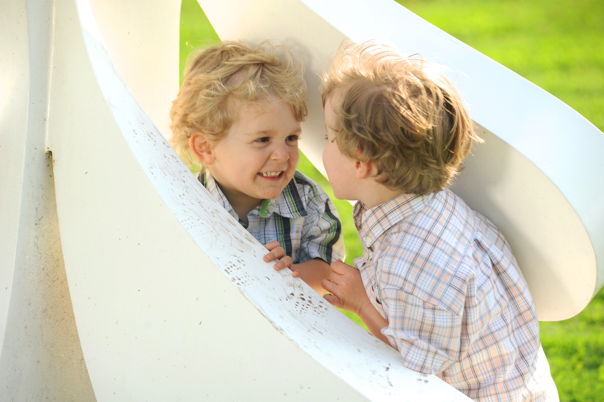 Best Metro Detroit lifestyles photographer's fun and candid children's and kids photos of two Michigan boys playing in Metro Detroit and the Birmingham parks, Michigan.