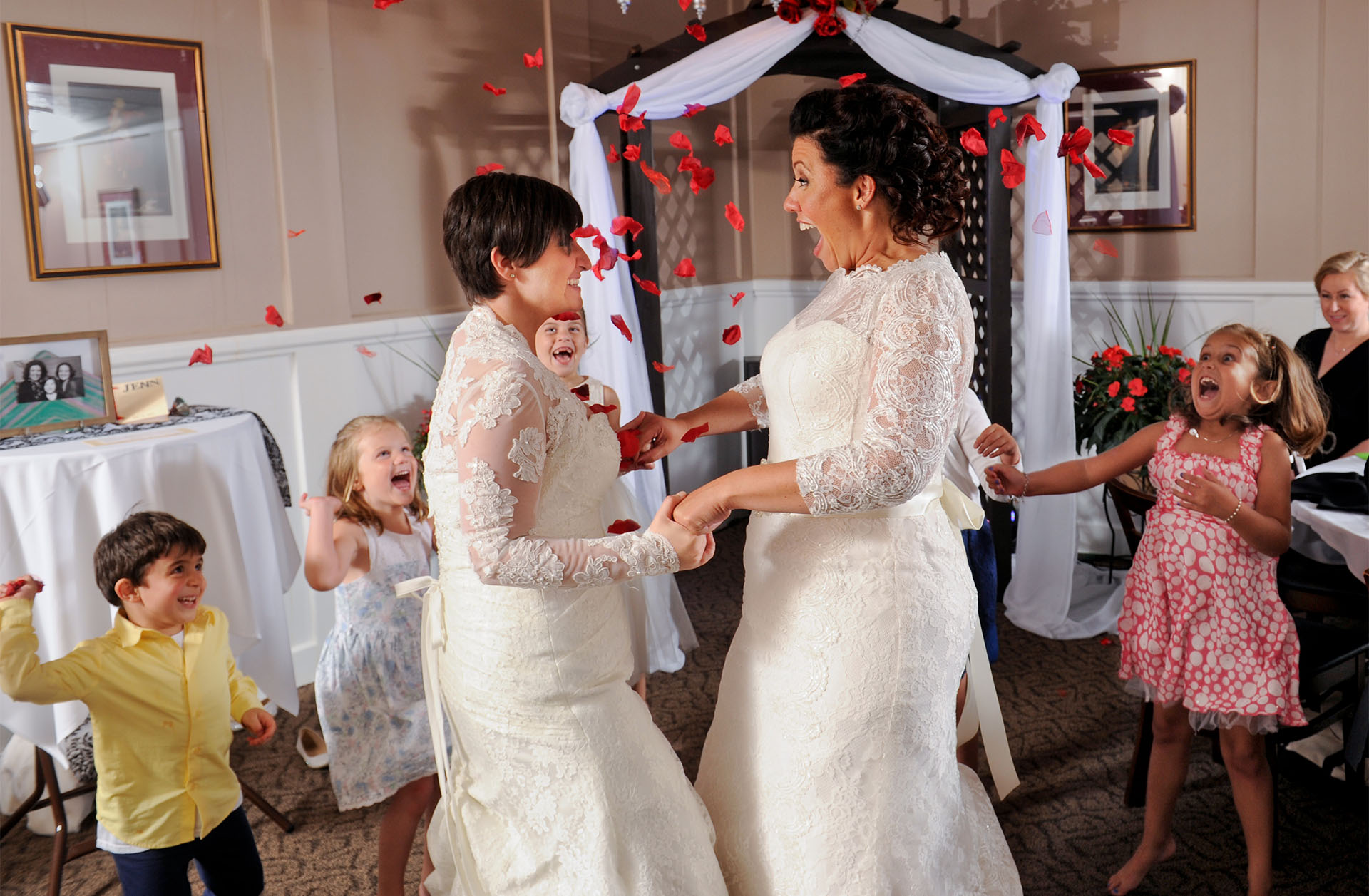 Two brides celebrate at their same sex wedding in Livonia, Michigan.