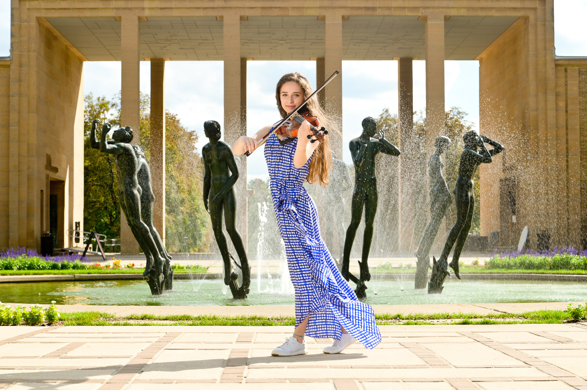Rachel started her senior picture session at Cranbrook Kingswood High School in Bloomfield Hills at the iconic Cranbrook Art Museum. We started with one of their statues.