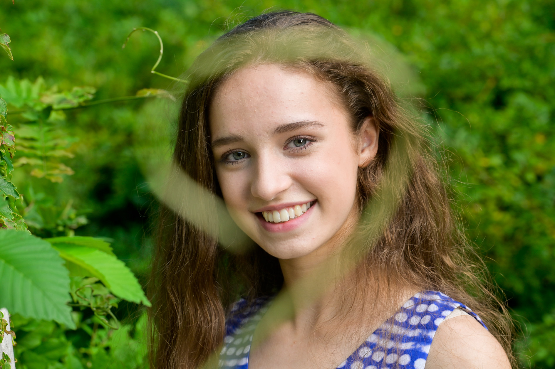 Rachel starts to relax into the crazy swirling vine that outlines her face at Cranbrook Kingswood High School in Bloomfield Hills.