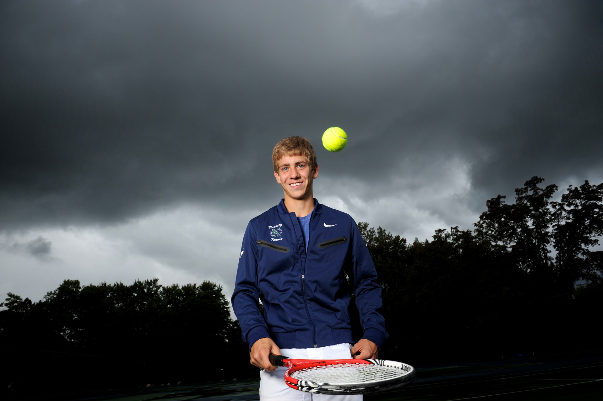 cranbrook, Michigan senior photographer's photo taken of a tennis player in a storm at Cranbrook School in Bloomfield, Michigan.