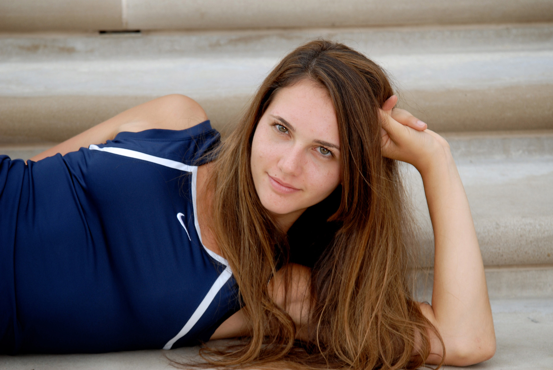 Cranbrook School in Bloomfield, Michigan senior photos of a high school senior close up on the steps of the art museum at a Cranbrook Senior Photo shoot.
