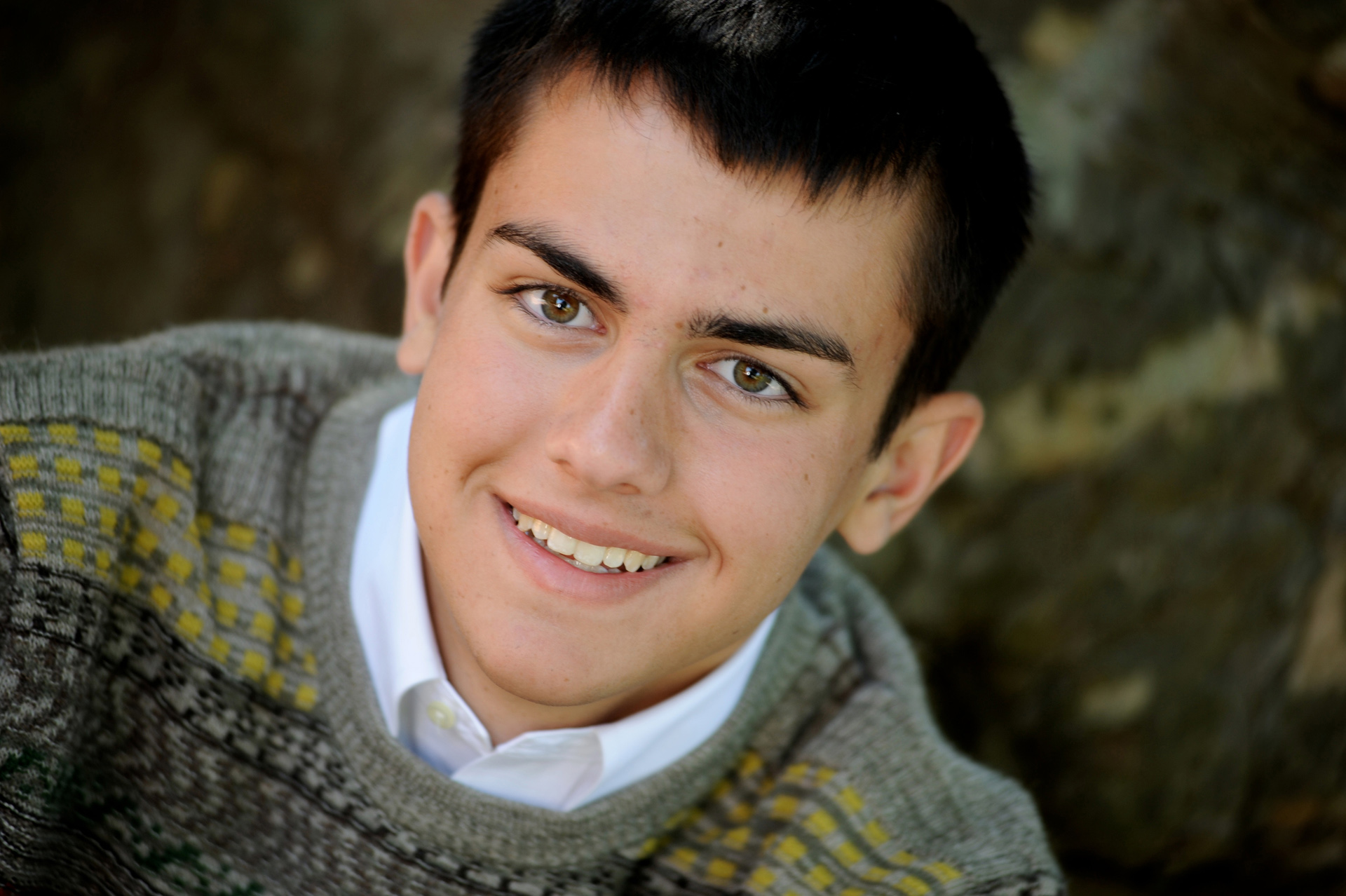 Cranbrook School in Bloomfield, Michigan senior photographer shows a Cranbrook high school senior using a piece of art from the Cranbrook School in Bloomfield, Michigan.