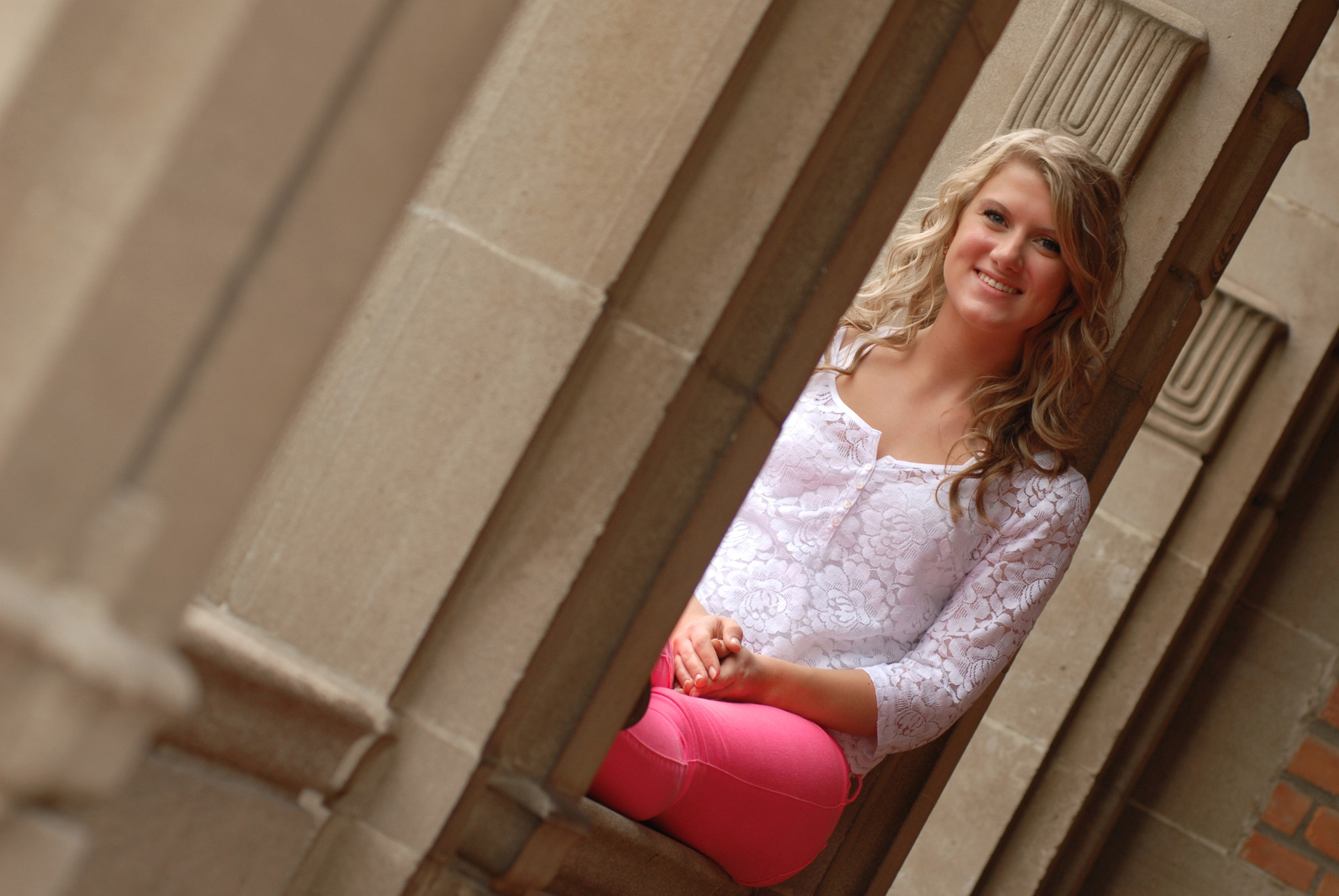 Cranbrook School in Bloomfield, Michigan senior photographer's photo taken of a high school senior amongst one of many sets of pillars at Cranbrook in Bloomfield, Michigan.