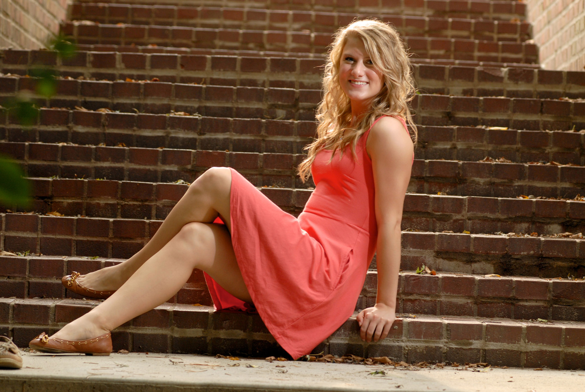 Cranbrook School in Bloomfield, Michigan senior photographer shows a high school senior posing in great light for  her senior pictures at the Cranbrook School in Bloomfield, Michigan on one of their many staircases.