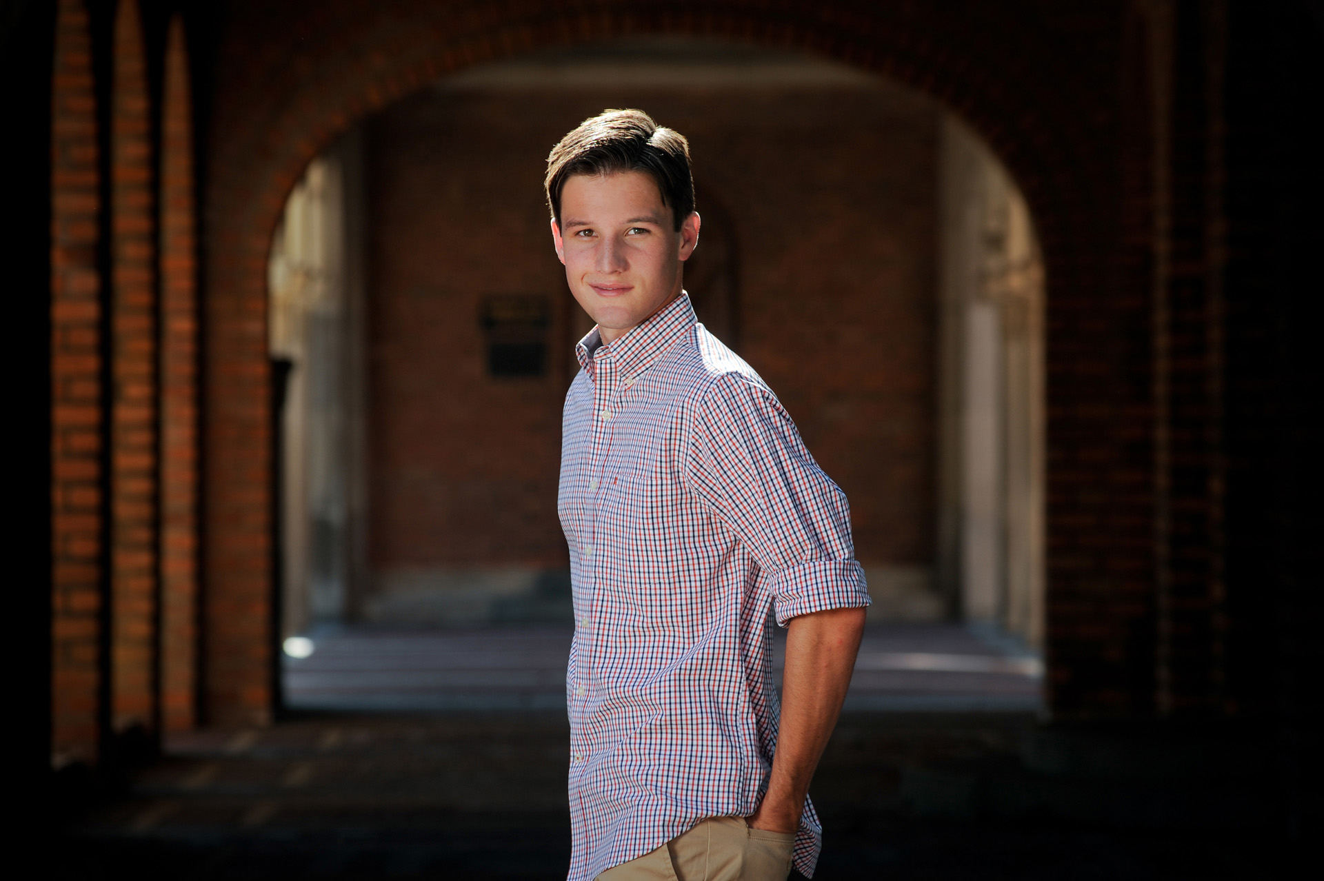Cranbrook School in Bloomfield, Michigan senior photographer shows a high school senior at one of the most iconic structures on his school's private campus for his senior photo shoot.