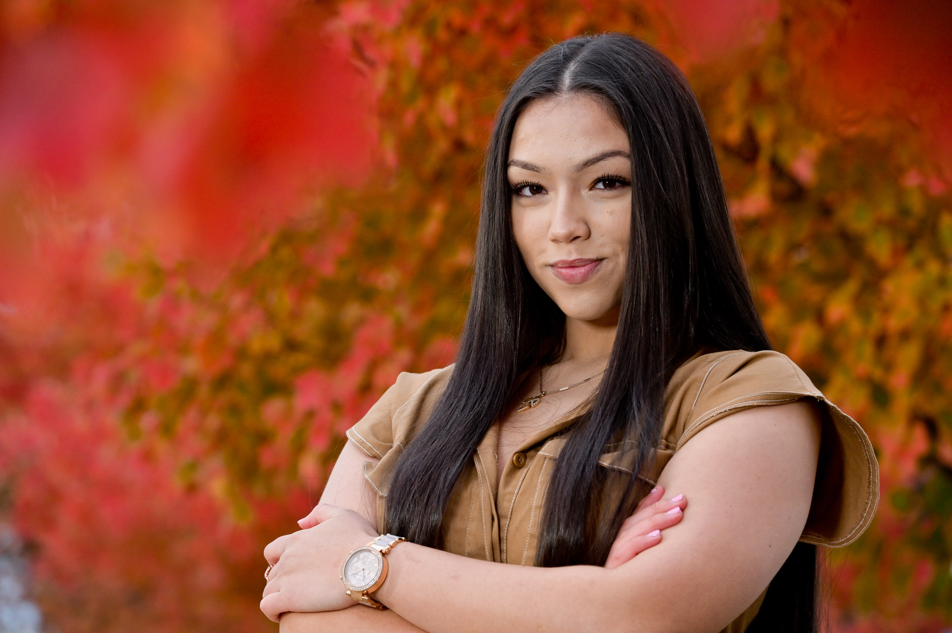 A high school senior girl in the fall in Detroit, Michigan for her senior photos.