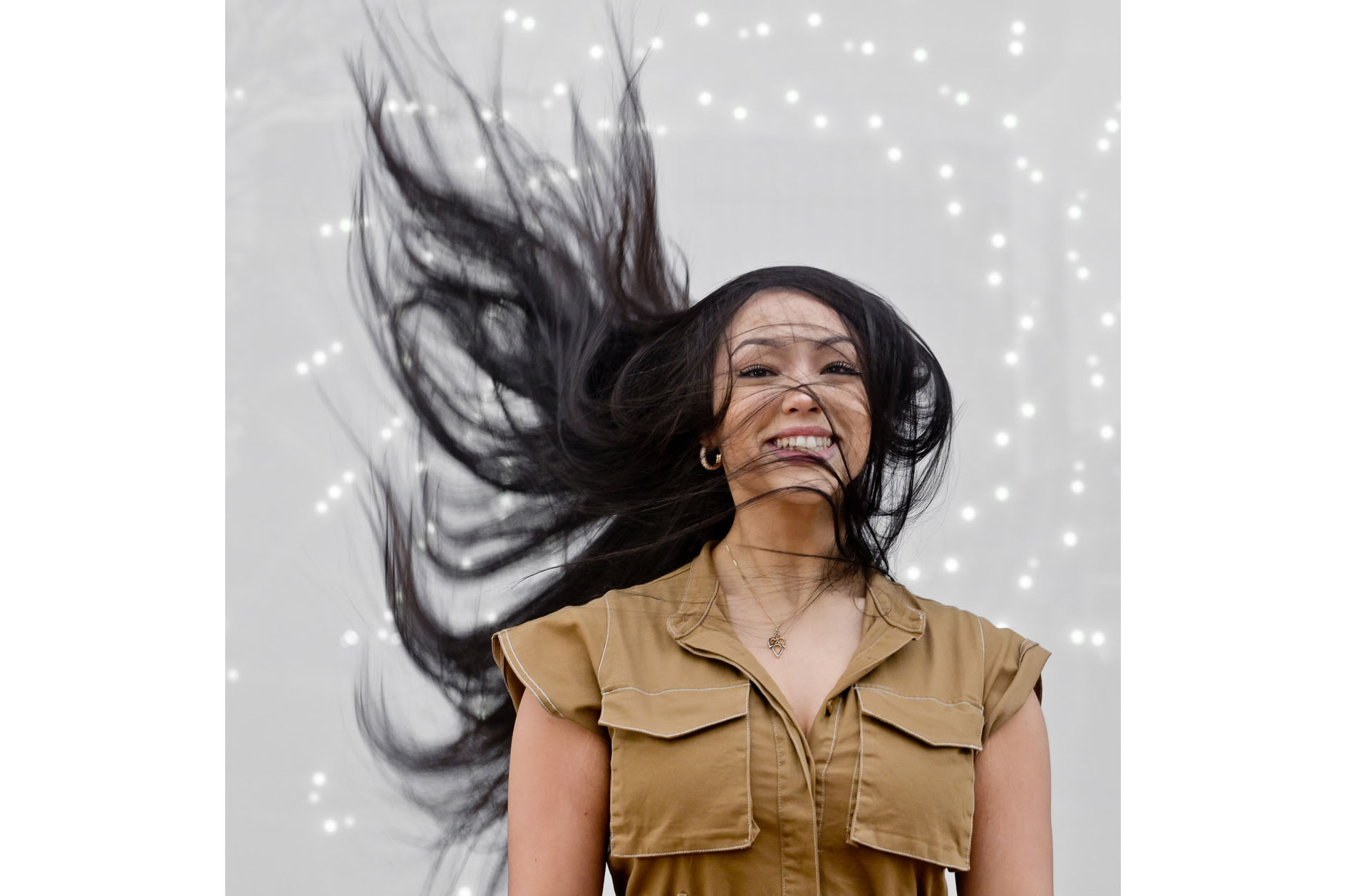 A high school senior girl's hair goes wild at a found art installation in Detroit, Michigan.