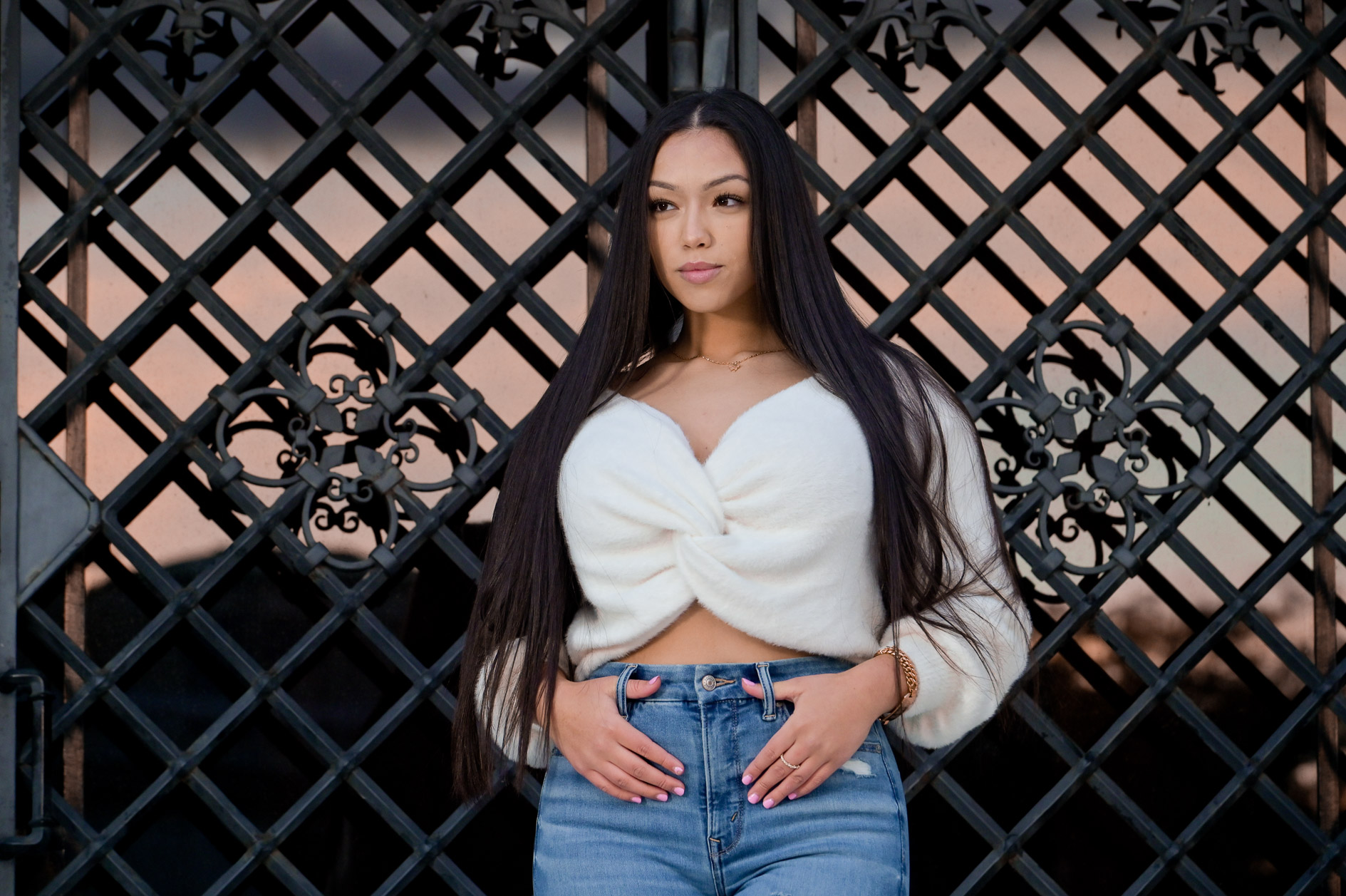 A high school senior girl posing at the Detroit Institute of Arts in Detroit, Michigan.