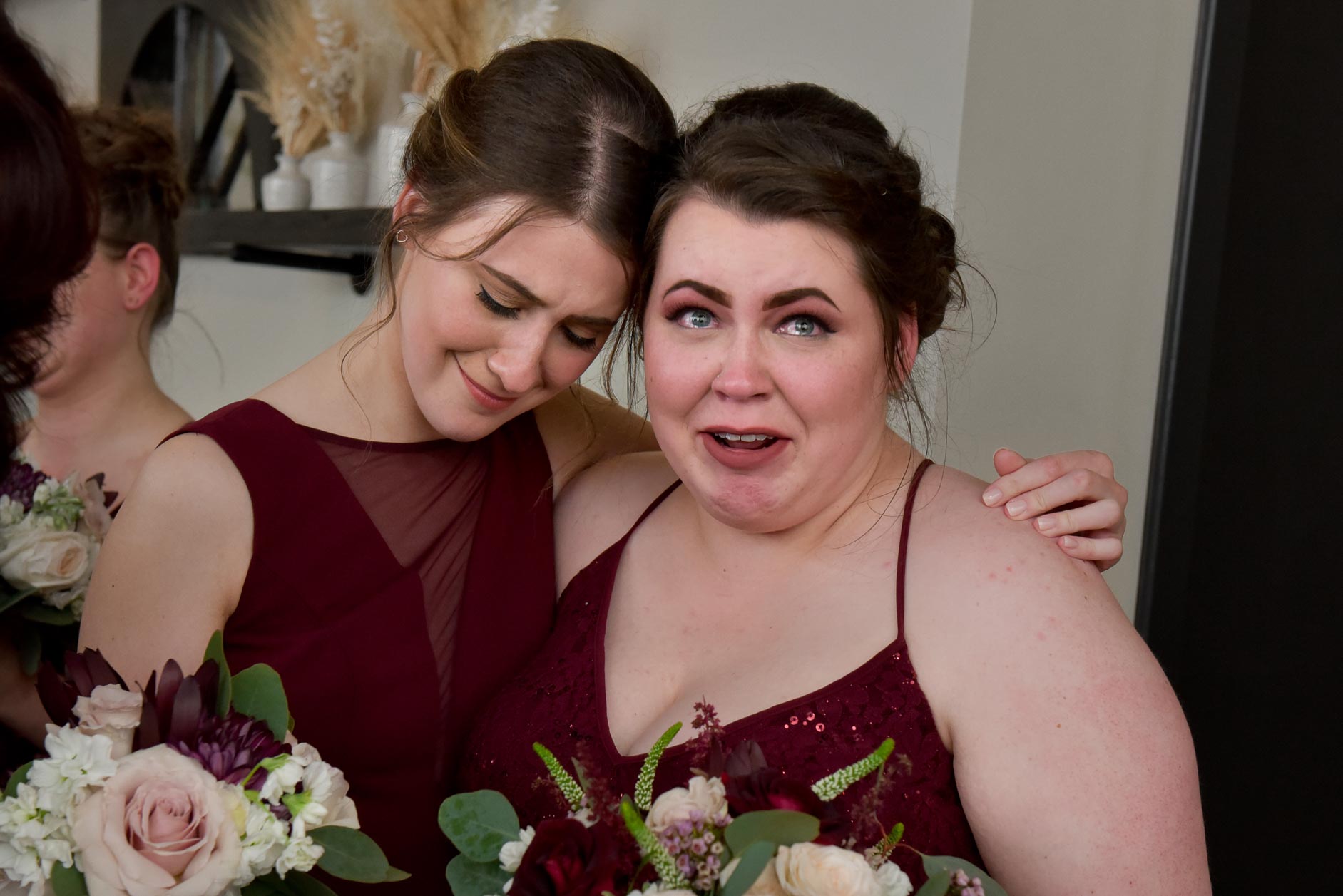 The maid of honor is comforted after her sister's wedding downtown Detroit, Michigan.