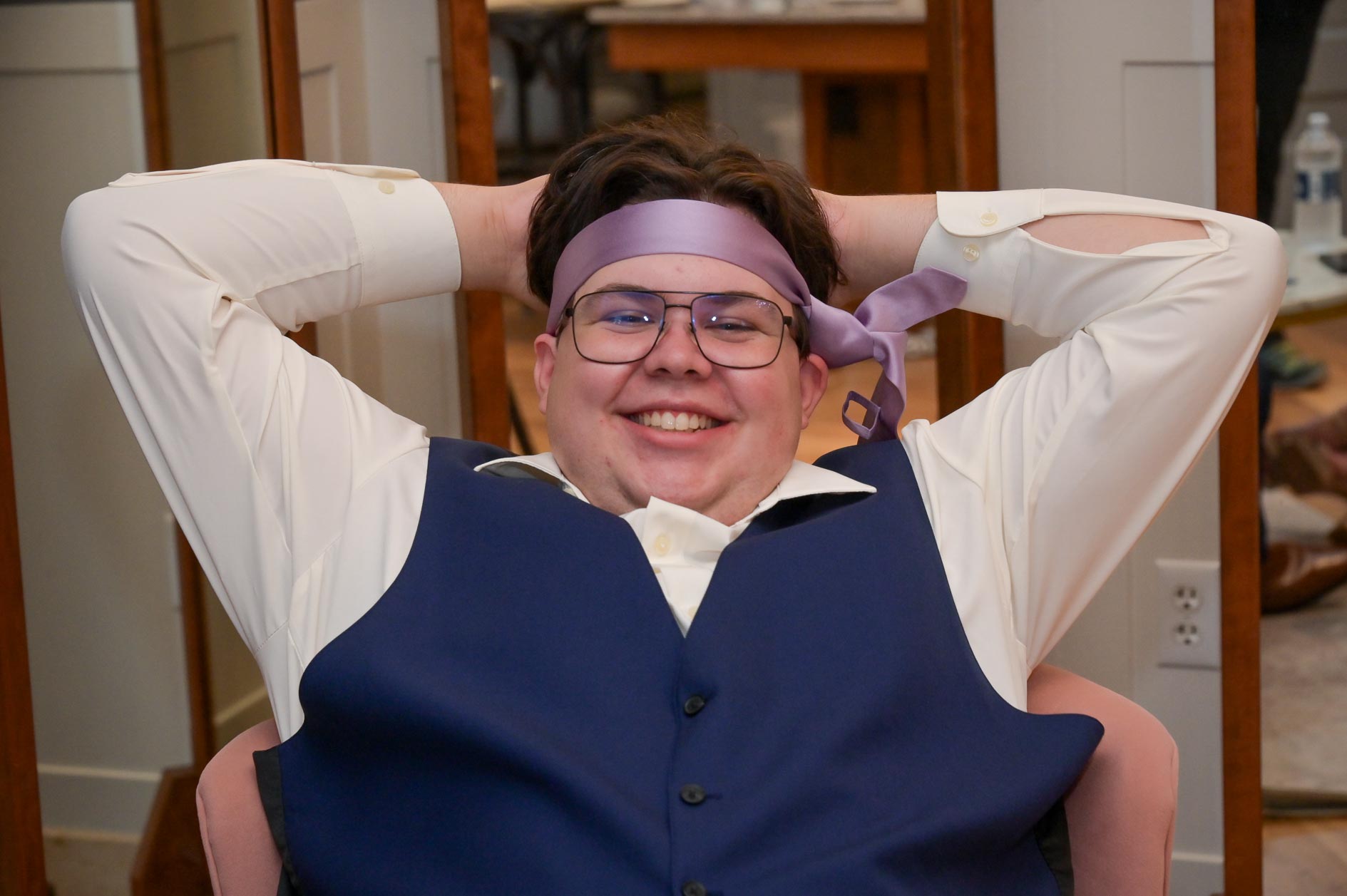 A groomsman takes a time out after the wedding at 2 Gather More in Auburn Hills, Michigan.