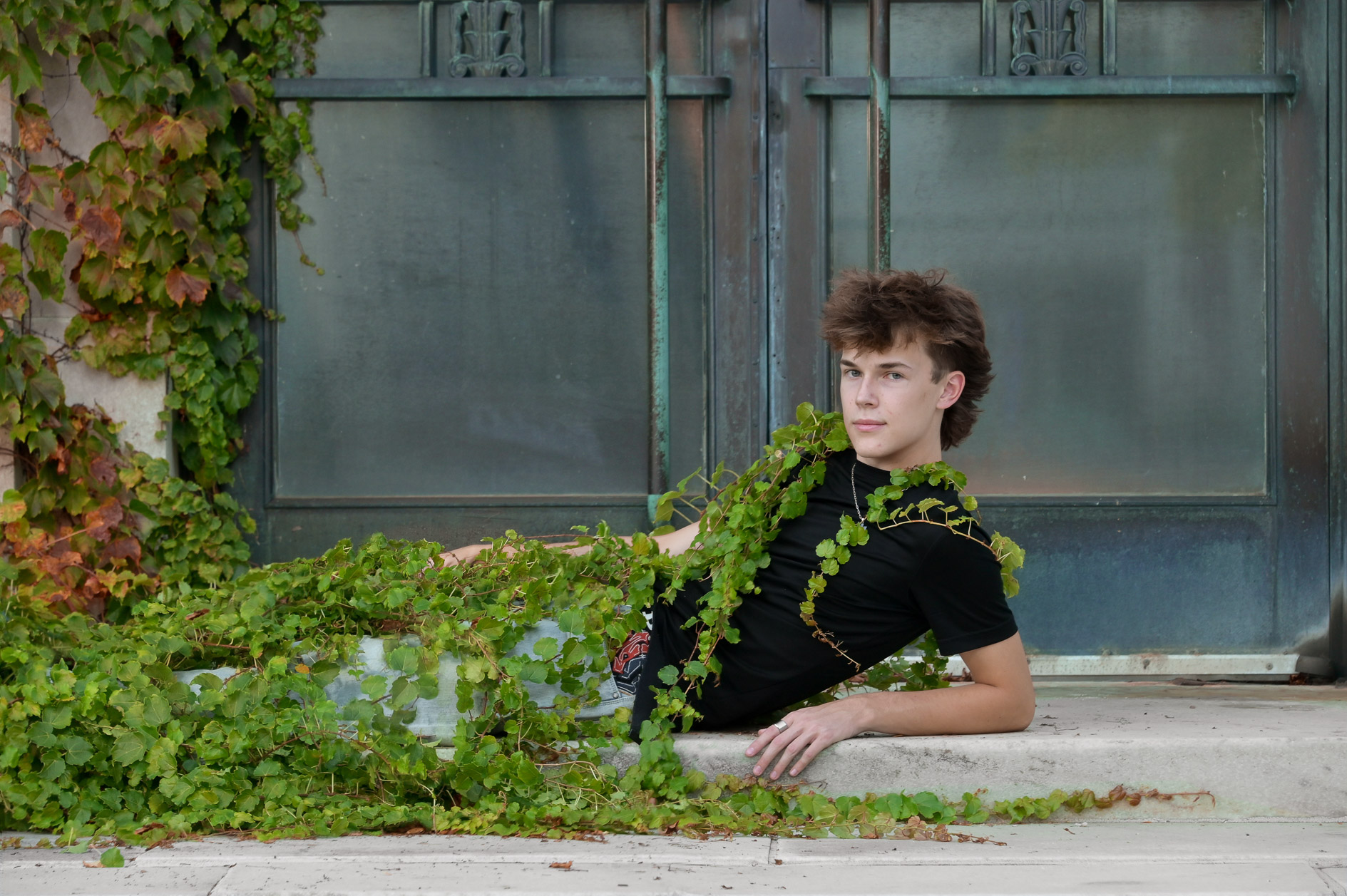 Royal Oak high school senior posing for the artistic photo in the leaves in downtown Detroit, Michigan.