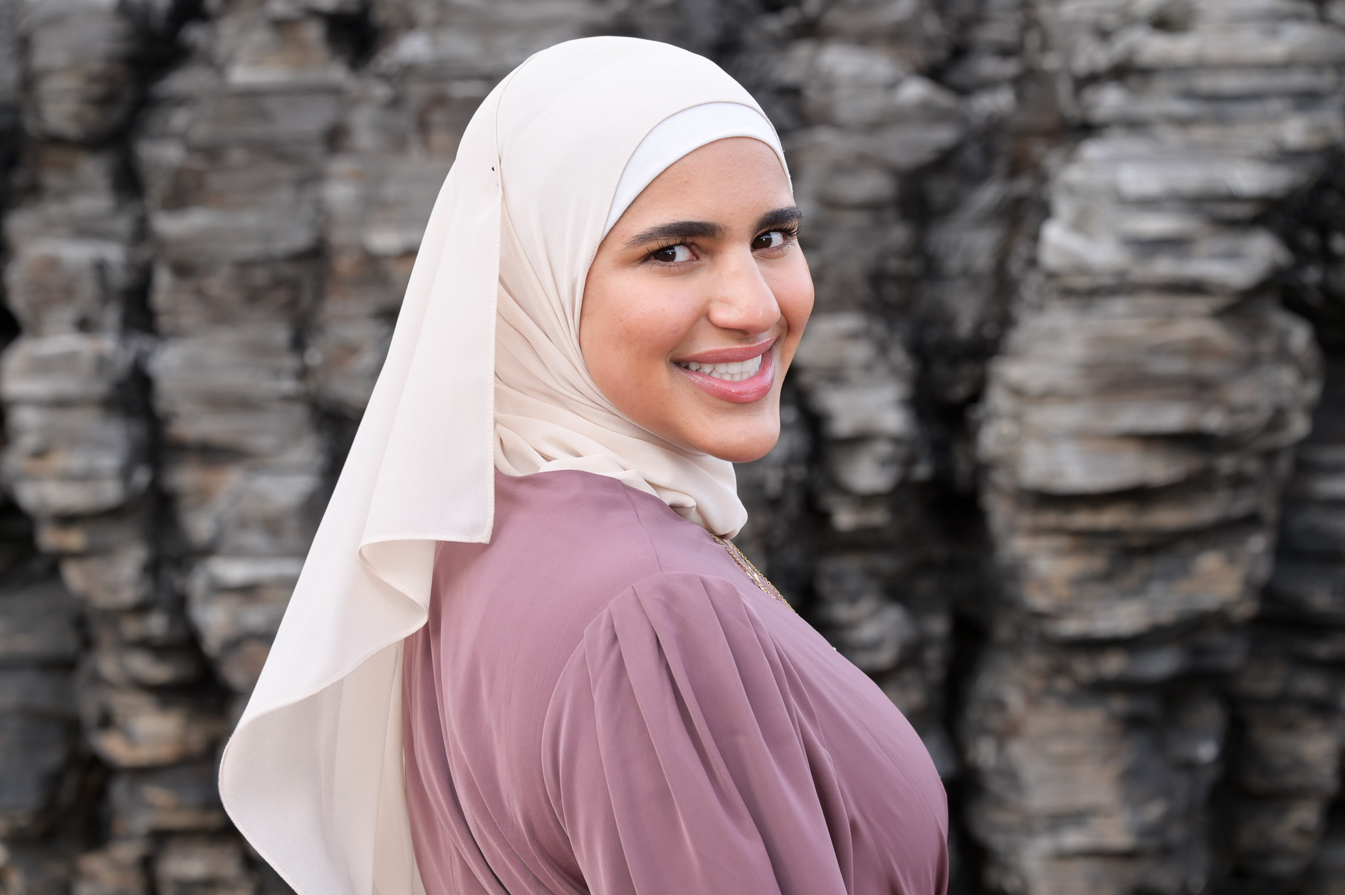 A Muslim Birmingham, Michigan high school senior poses for her senior photos downtown Detroit.