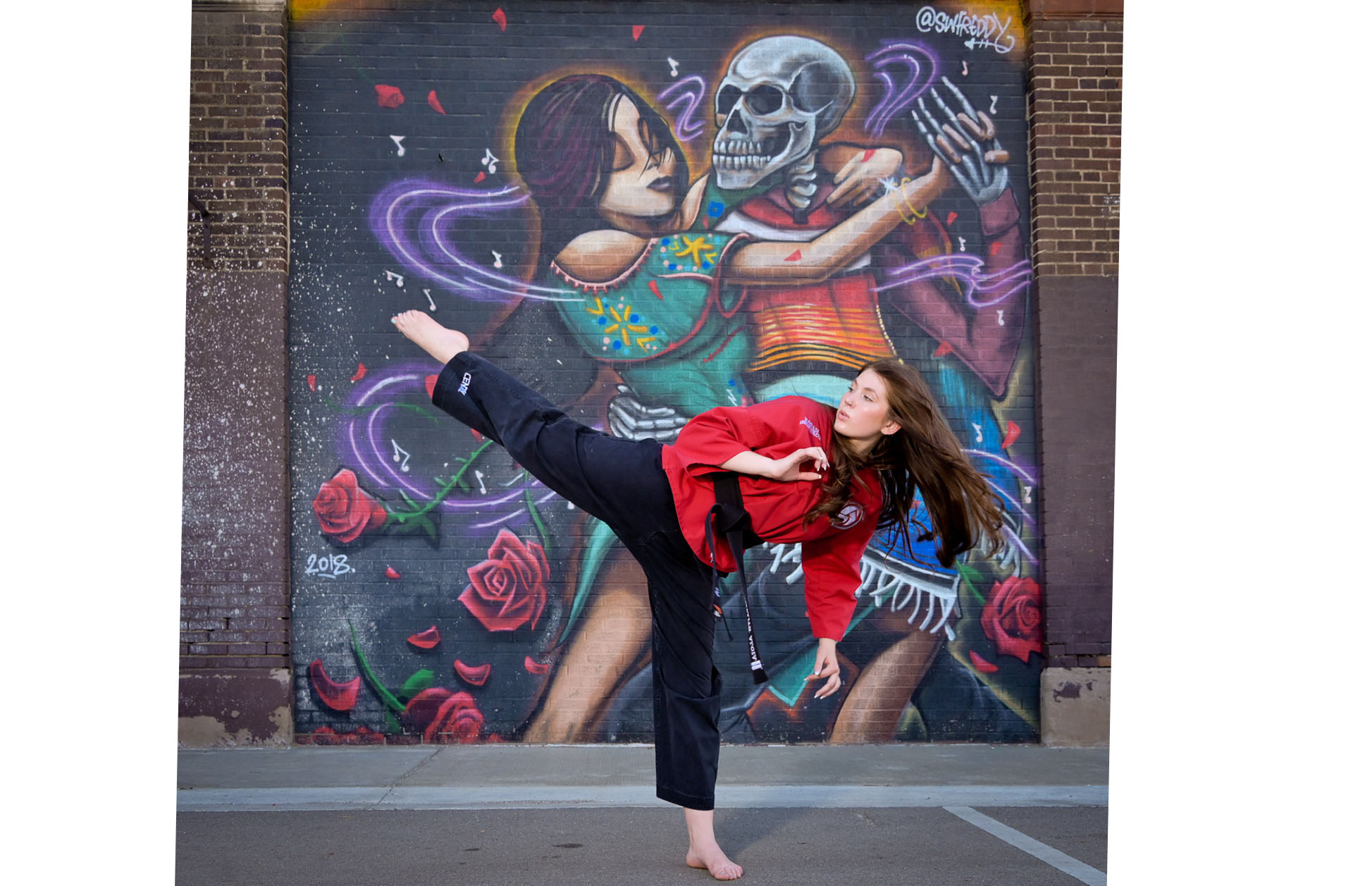A Birmingham, Michigan high school senior shows off her taekwondo skills downtown Detroit.
