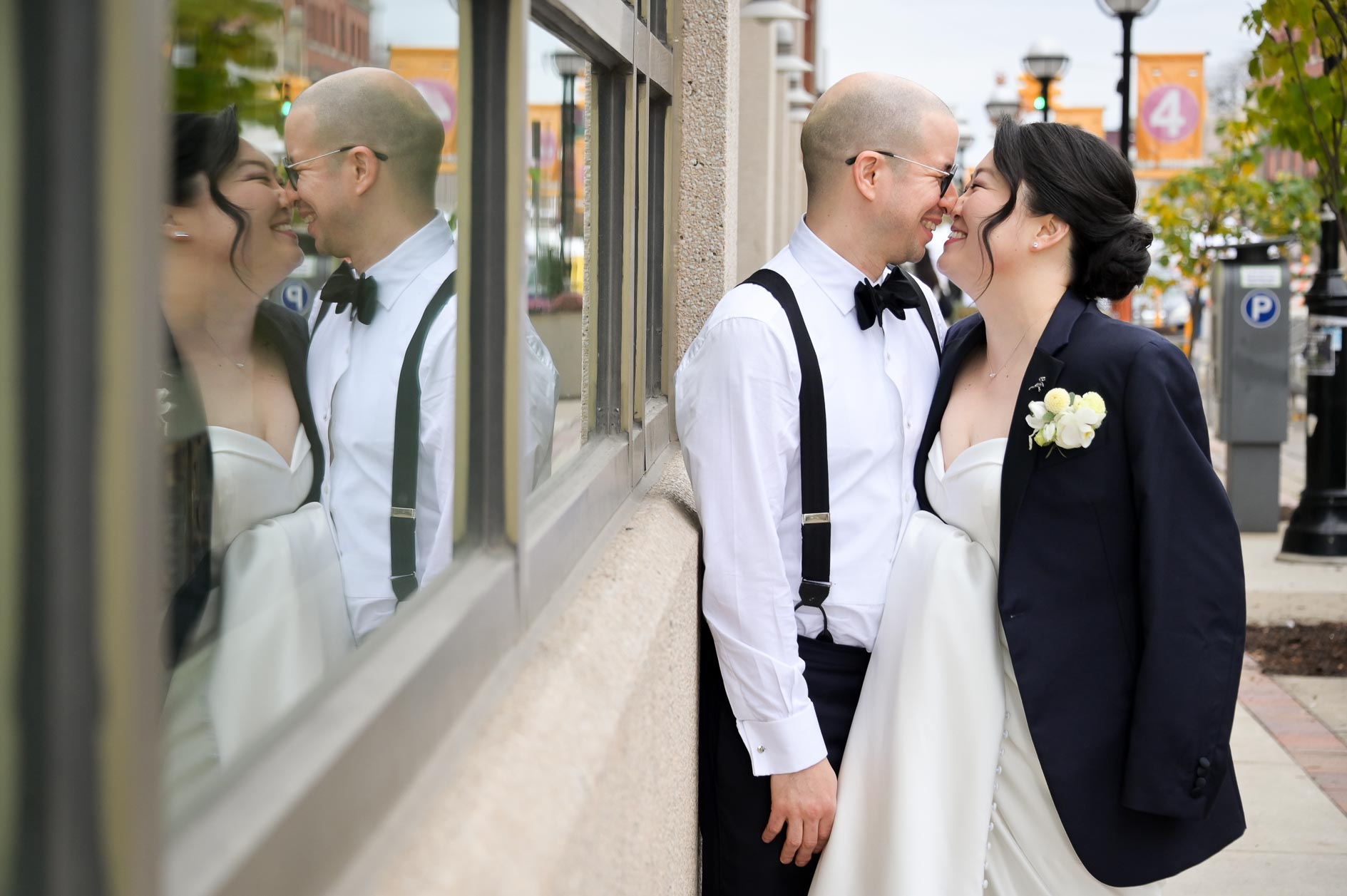 The bride and groom standing outside the restaurant where they had their first date in Ann Arbor, Michigan.