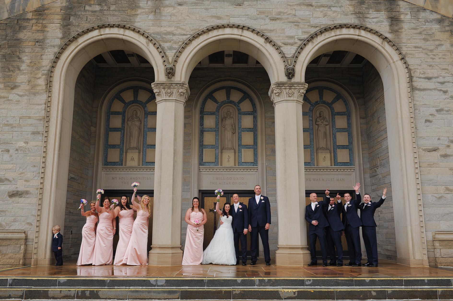 The wedding party waves as cars beep after their Catholic wedding at St. Anne Catholic Church in Warren, Michigan.