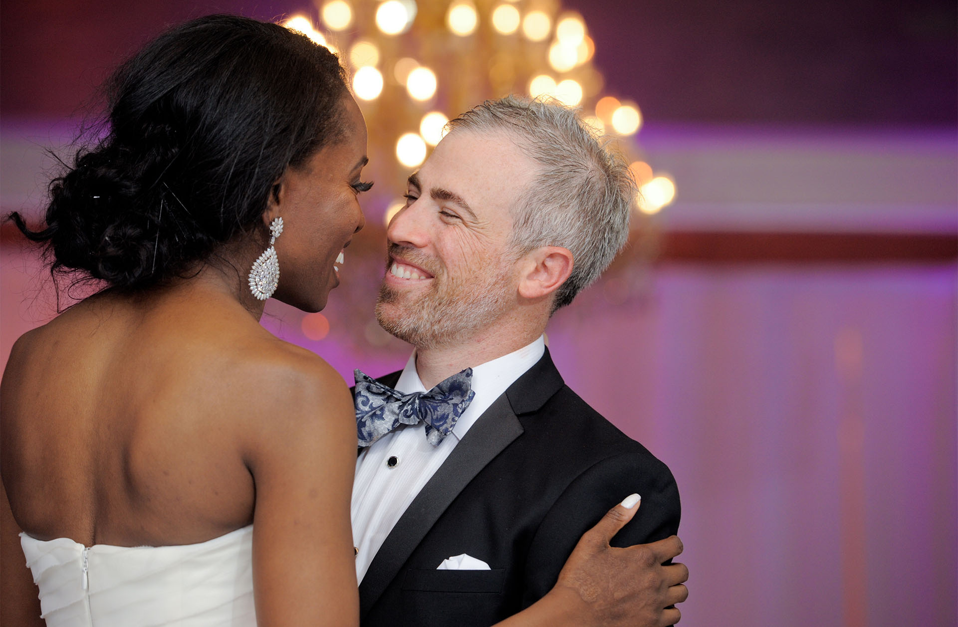 A slightly older couple enjoy their first dance for a Nigerian Jewish wedding in the metro Detroit, Michigan area.