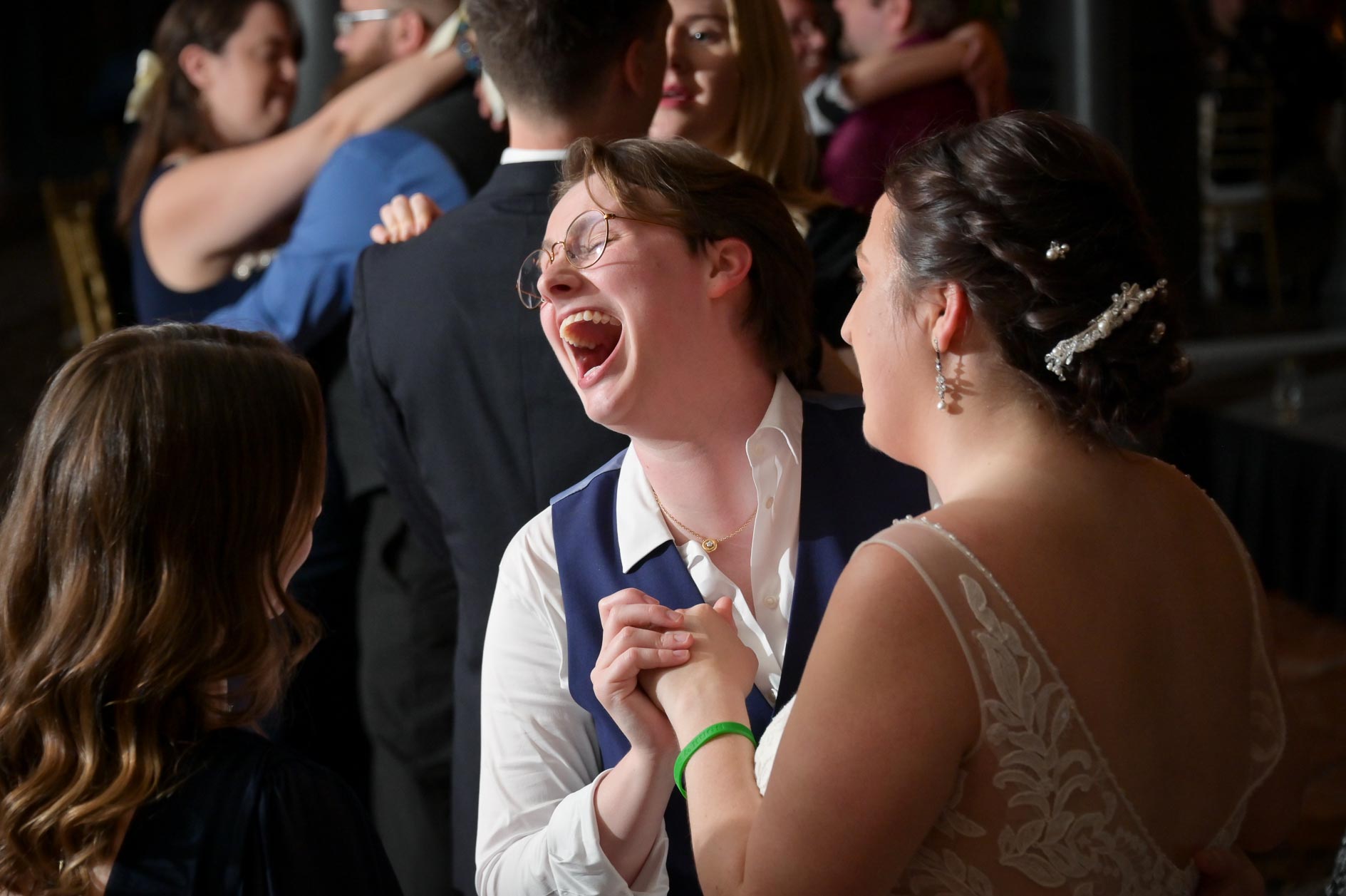 Guests belting along with the DJ at a Saint John's Resort wedding in Plymouth, Michigan.