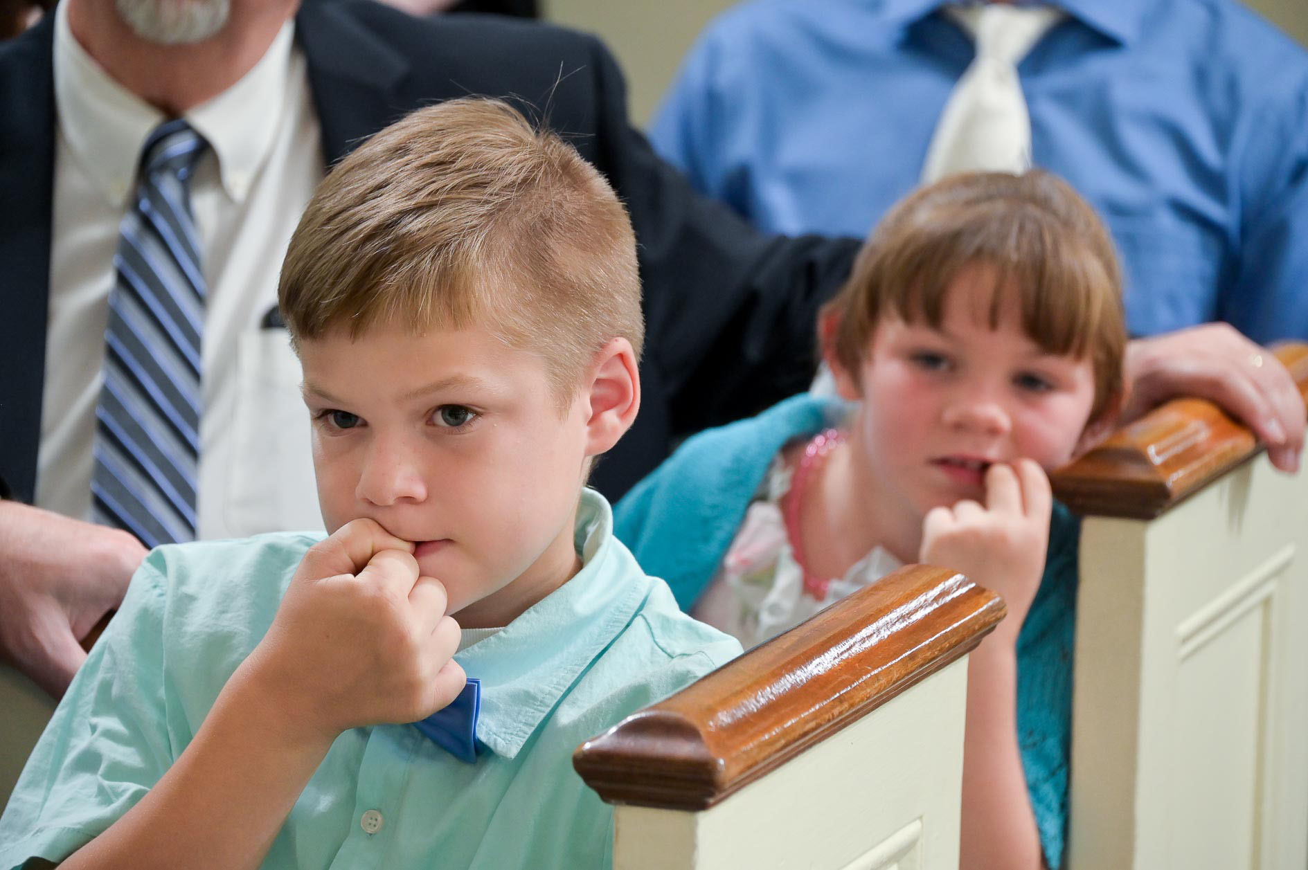 Nervous kids watch a wedding ceremony at the Mary Martha Chapel at Greenfield Village in Dearborn, Michigan.
