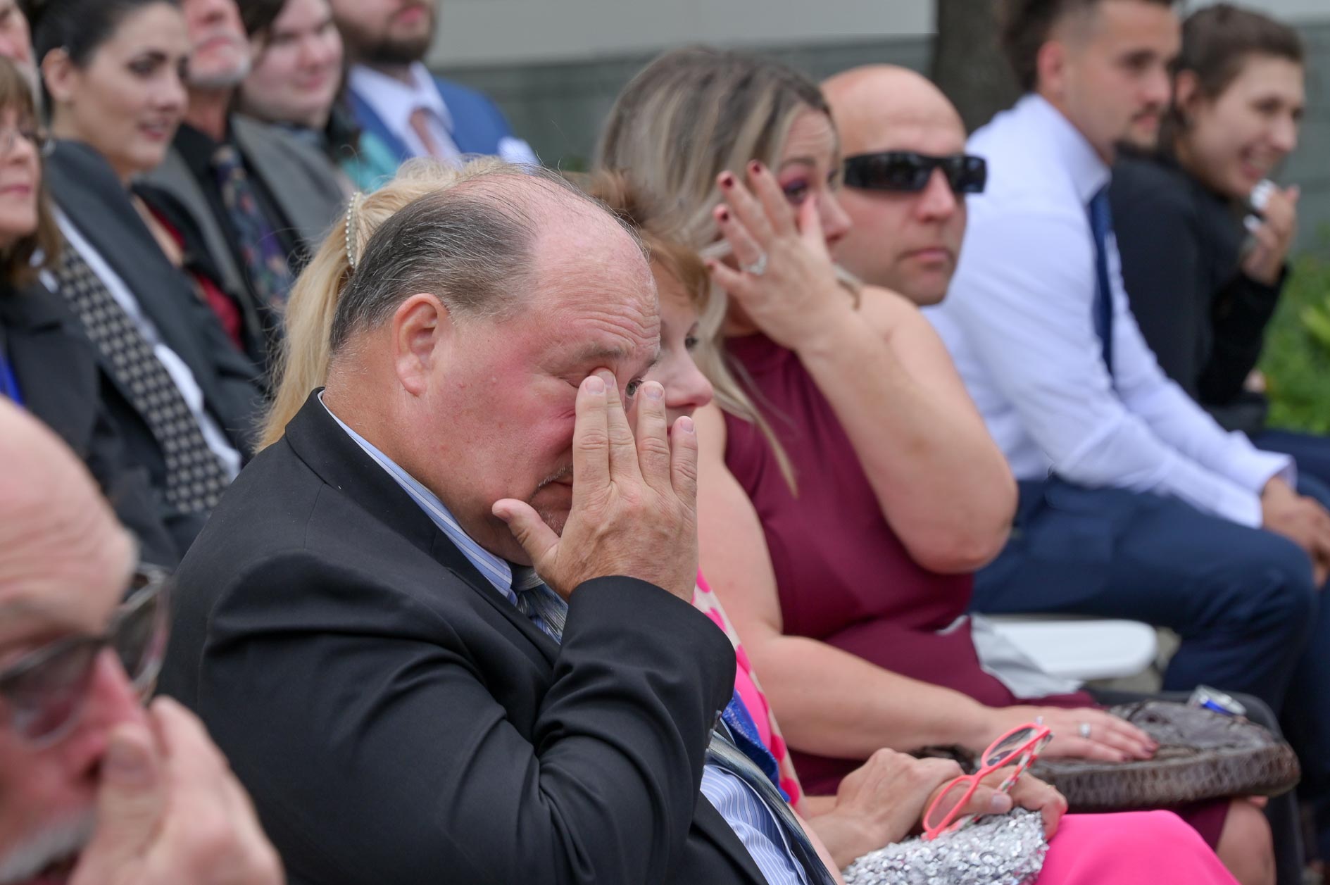 Not a dry eye in the row of wedding guests at this Twin lakes Golf Course wedding in Oakland Township, Michigan.