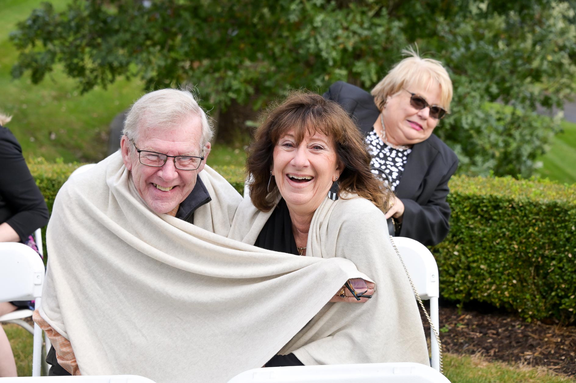 Guests bundle up for a chilly wedding at Beacon Hill Golf Course in Commerce Township, Michigan.