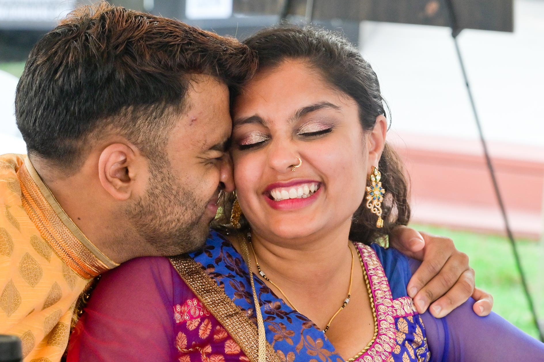 An Indian couple nuzzle during a ceremony along the shores of Detroit, Michigan.