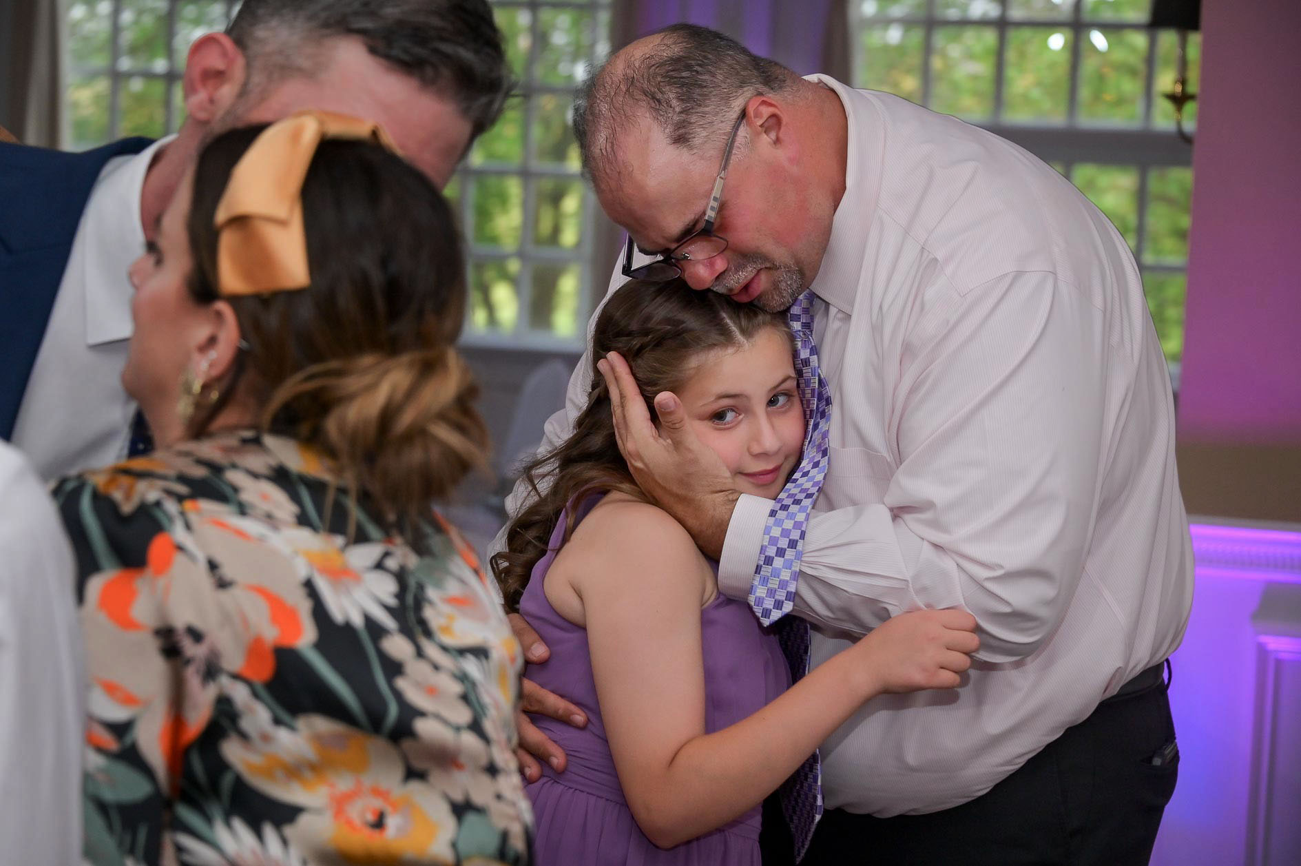 A grandfather and granddaughter dance at the wedding venue Wyndham Golf Club in Rochester, Michigan.