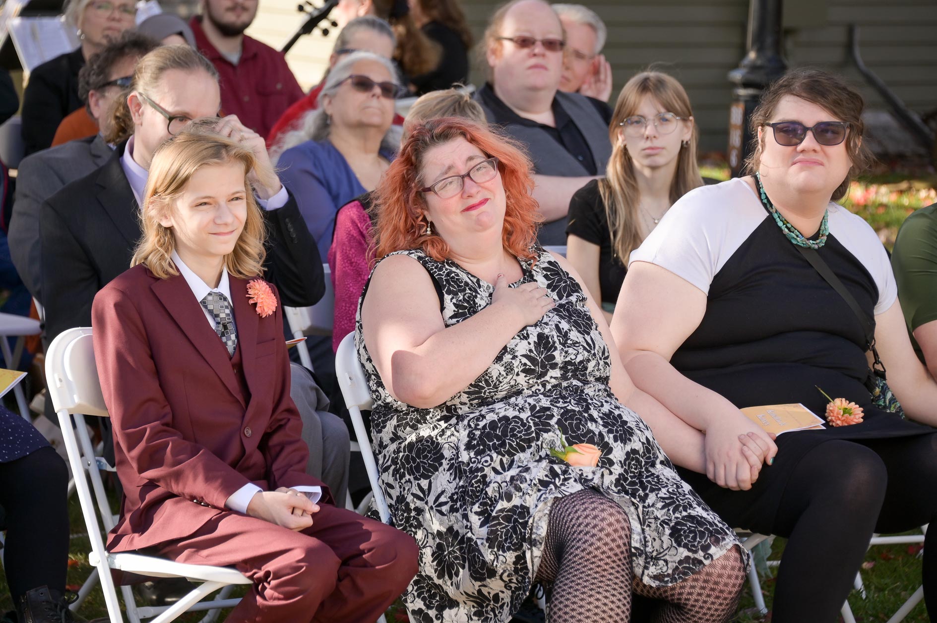Guests getting emotional during a wedding at the Troy Historical Society Village in Troy, Michigan.
