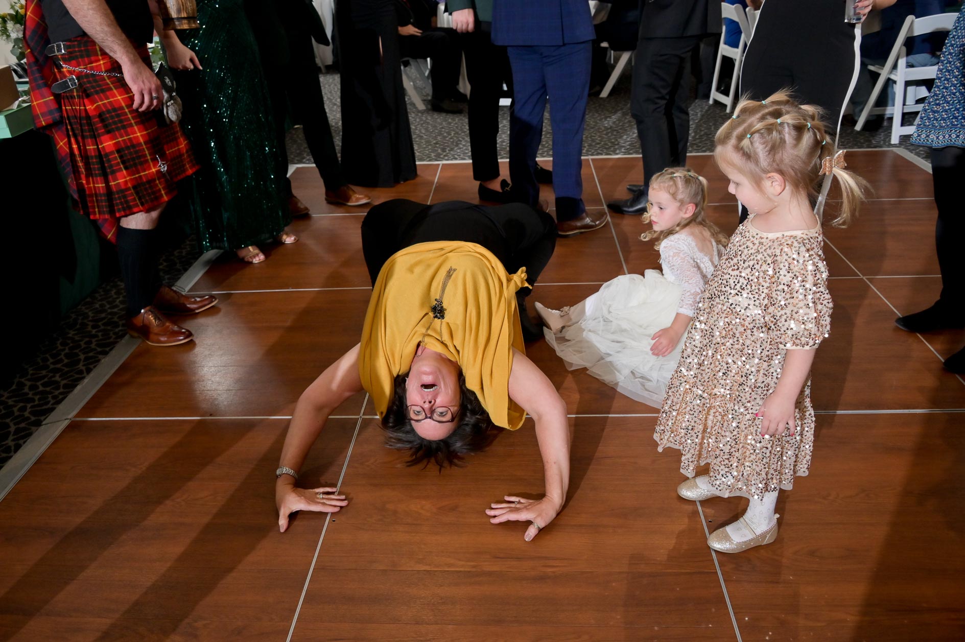 An aunt decides the dance floor is the perfect spot for a backbend in Traverse City, Michigan.