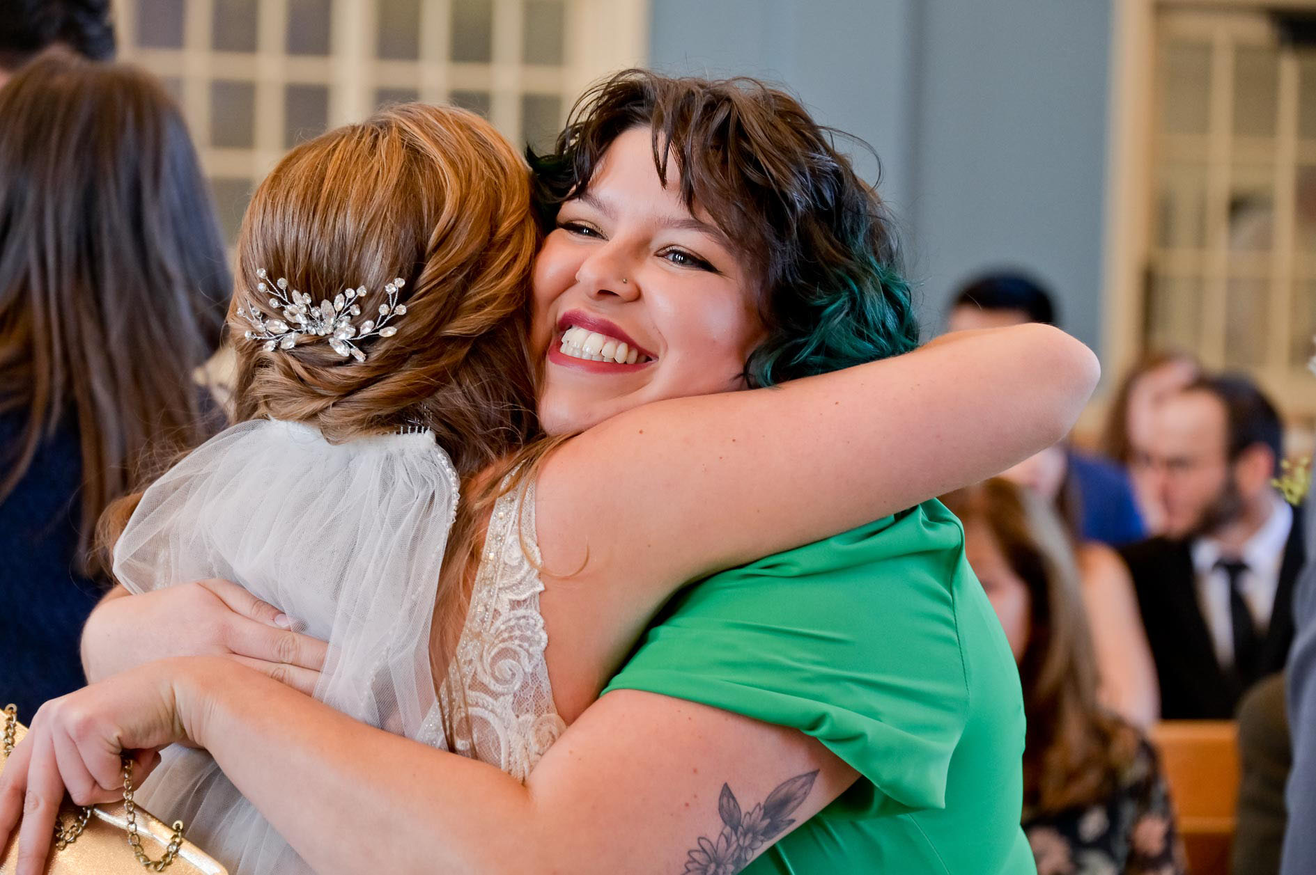 A guest hugs the bride after her wedding in Clarkston, Michigan.