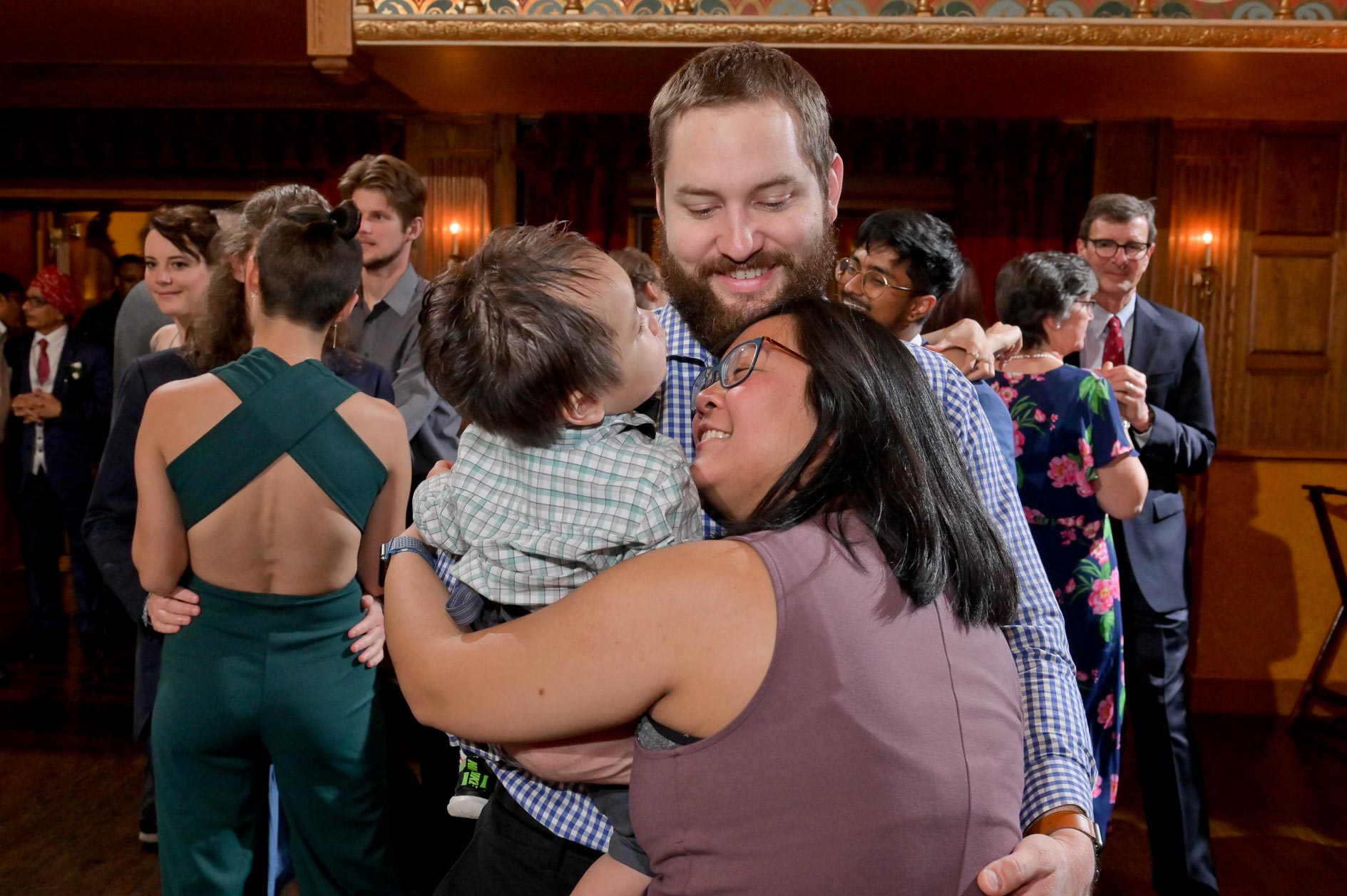 A family dance together at the Gem Theatre in Detroit during a wedding.