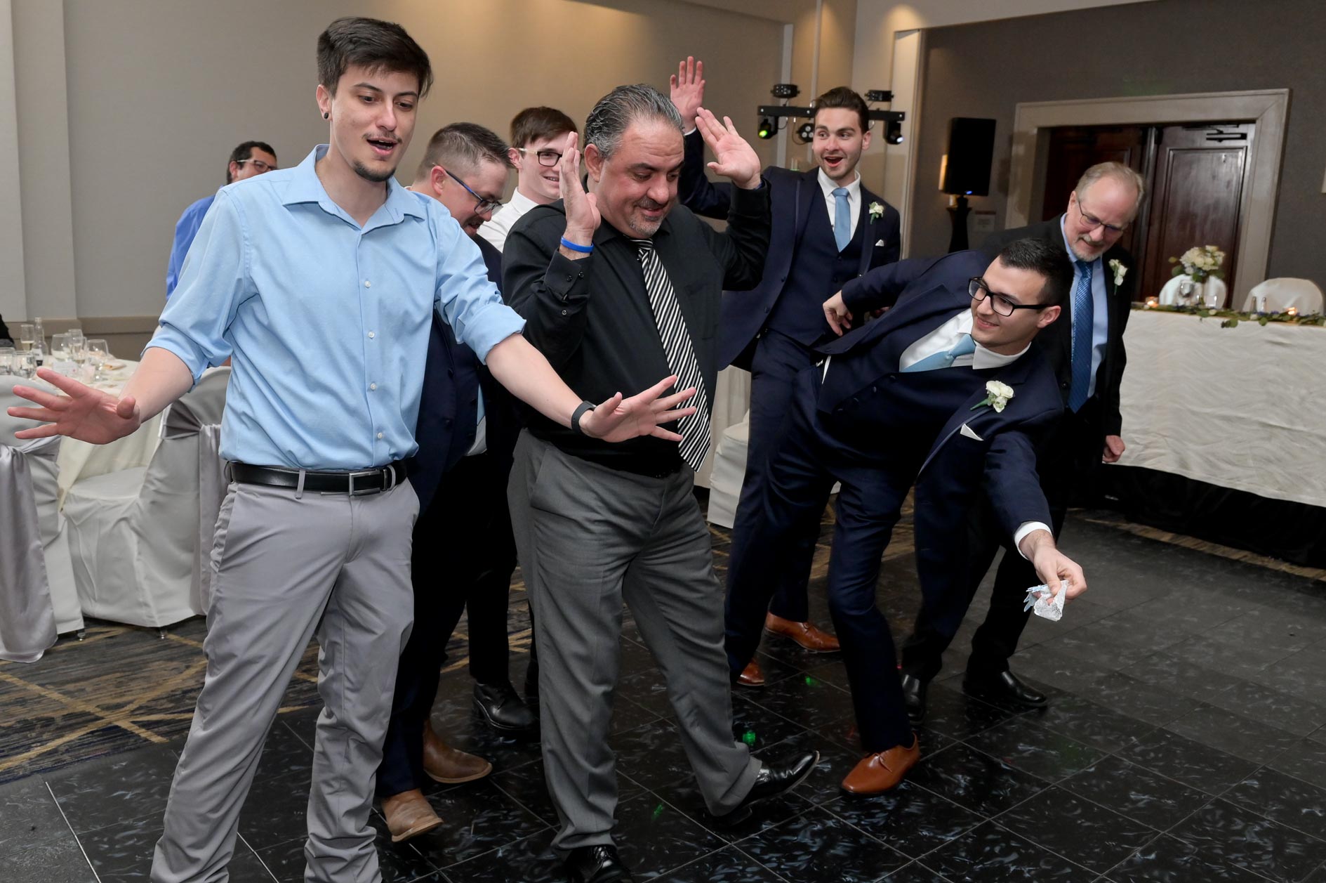 Absolutely no guest is willing to grab the garter at a wedding at San Marino Club in Troy, Michigan.