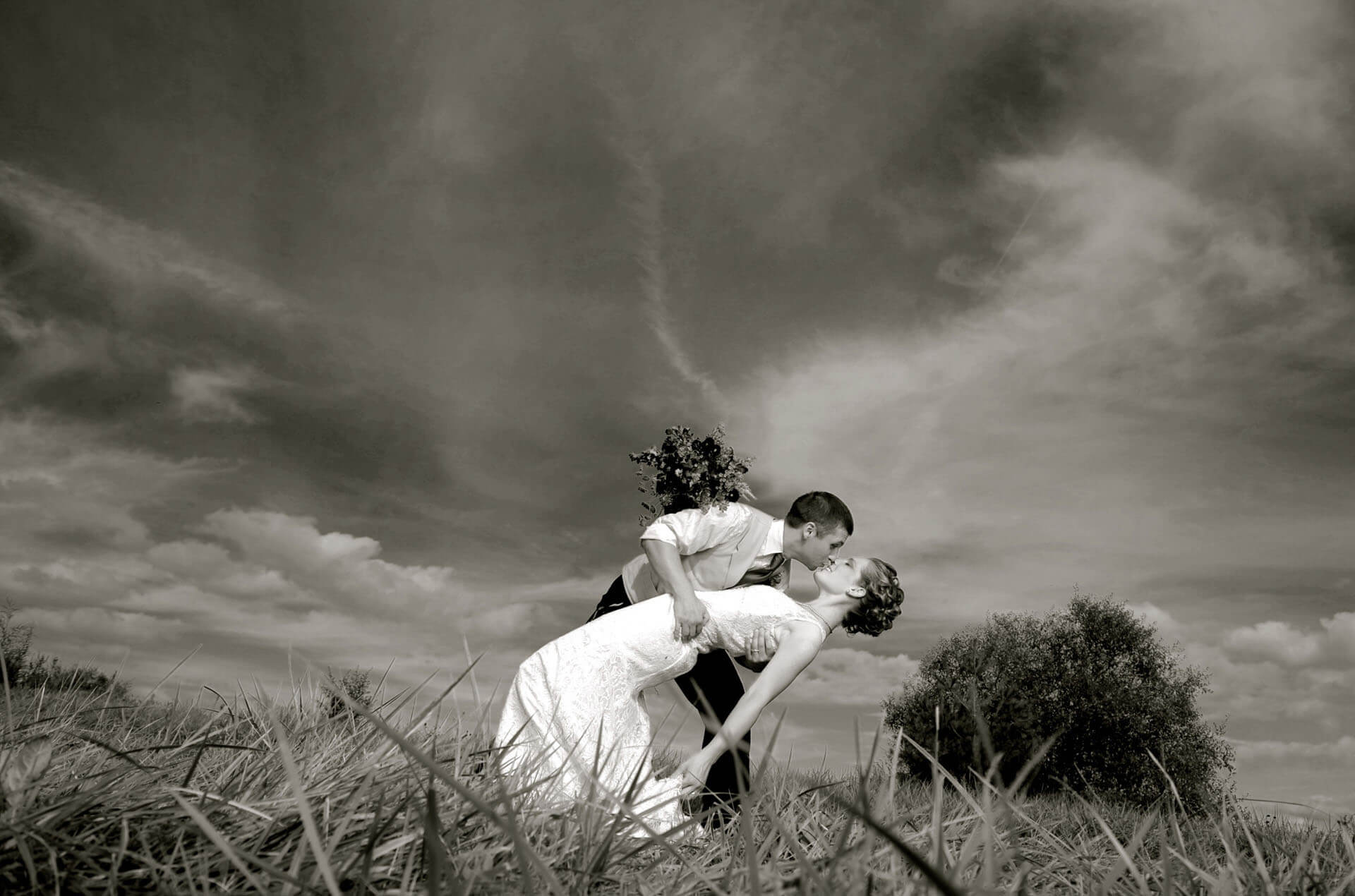 The classic dip on a Michigan farm after their down home wedding.