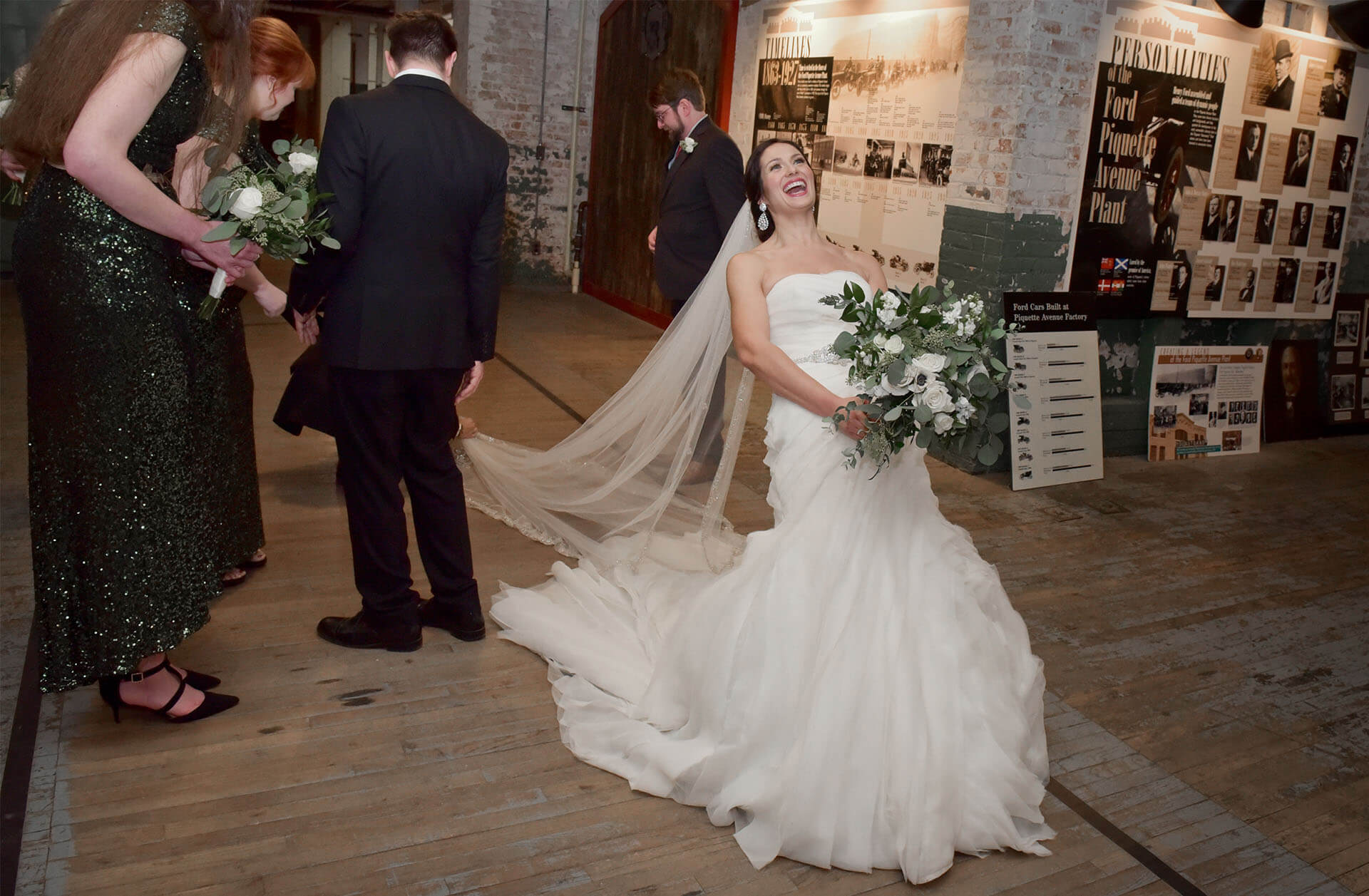 The bride's veil gets snagged on the floors during her winter wedding at the Ford Piquette Plant in Detroit, Michigan.
