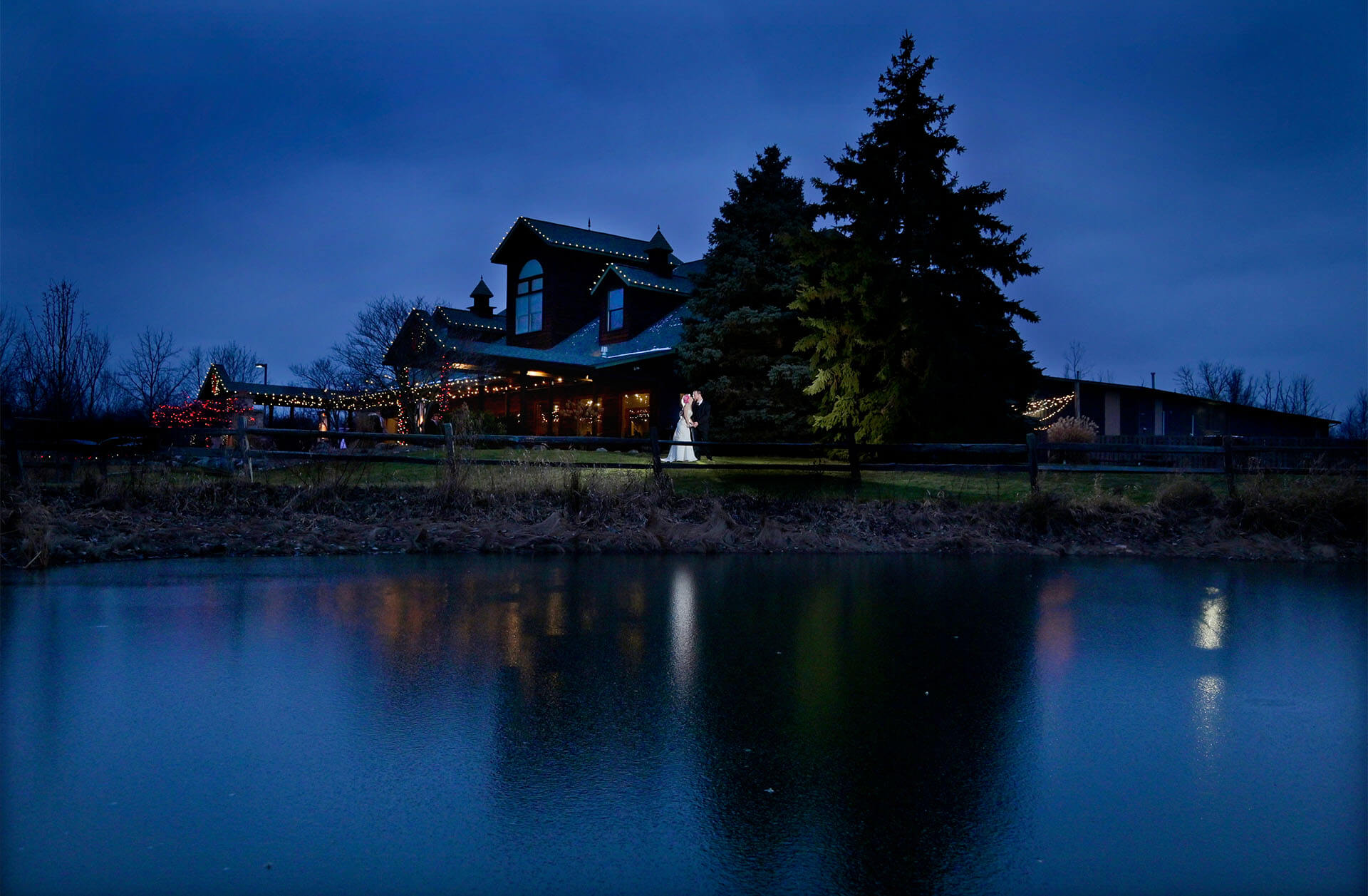 Couple poses as night falls at the Fenton Winery and Brewery in Fenton, Michigan.