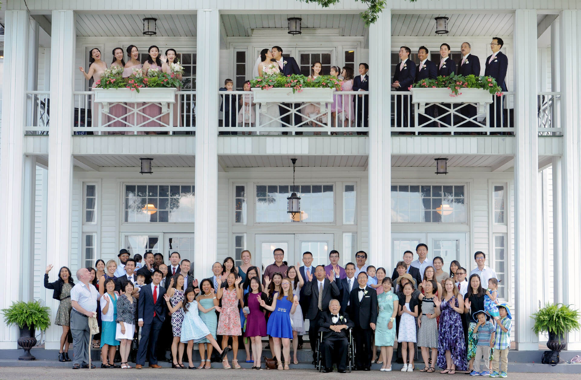 Epic Wedding portrait showing the entire wedding party and guests at Waldenwoods Resort in Howell, Michigan.