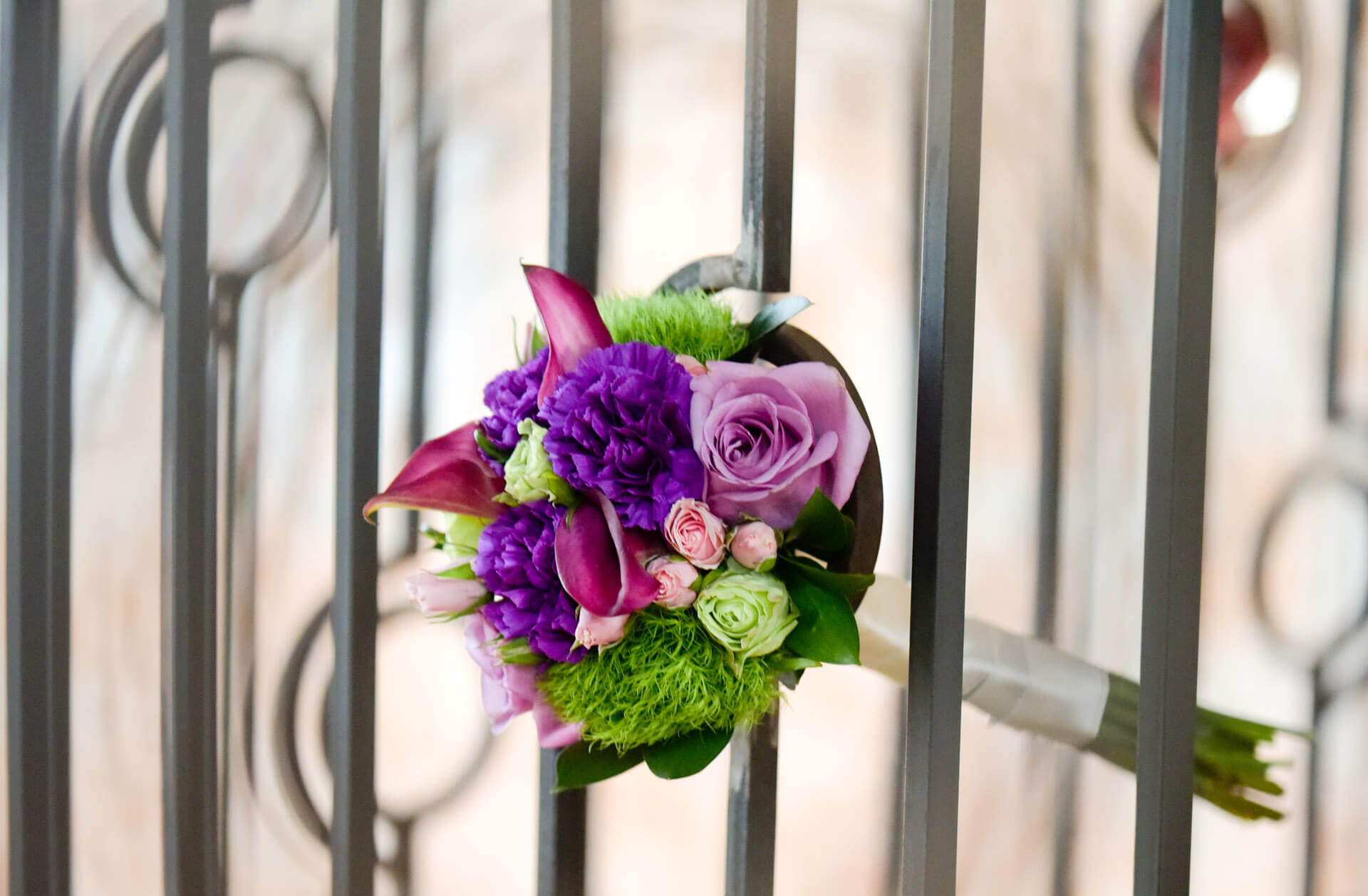 Epic Wedding portrait of the bride's bouquet sticking out of custom iron works at the Crofoot in Pontiac, Michigan wedding
