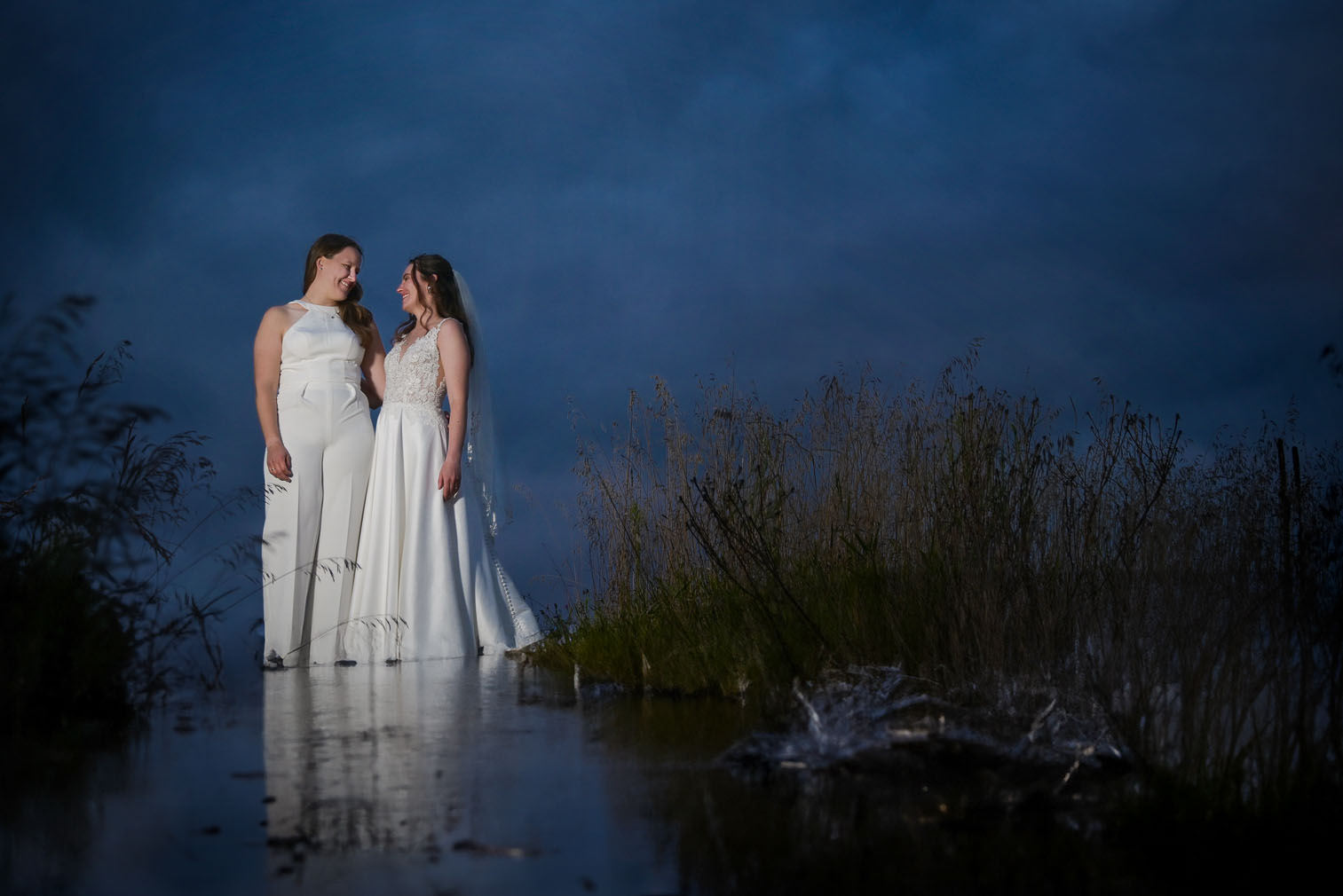 The brides after sun down after their LGBTQ wedding at their AirBnb in Grass Lake, Michigan.