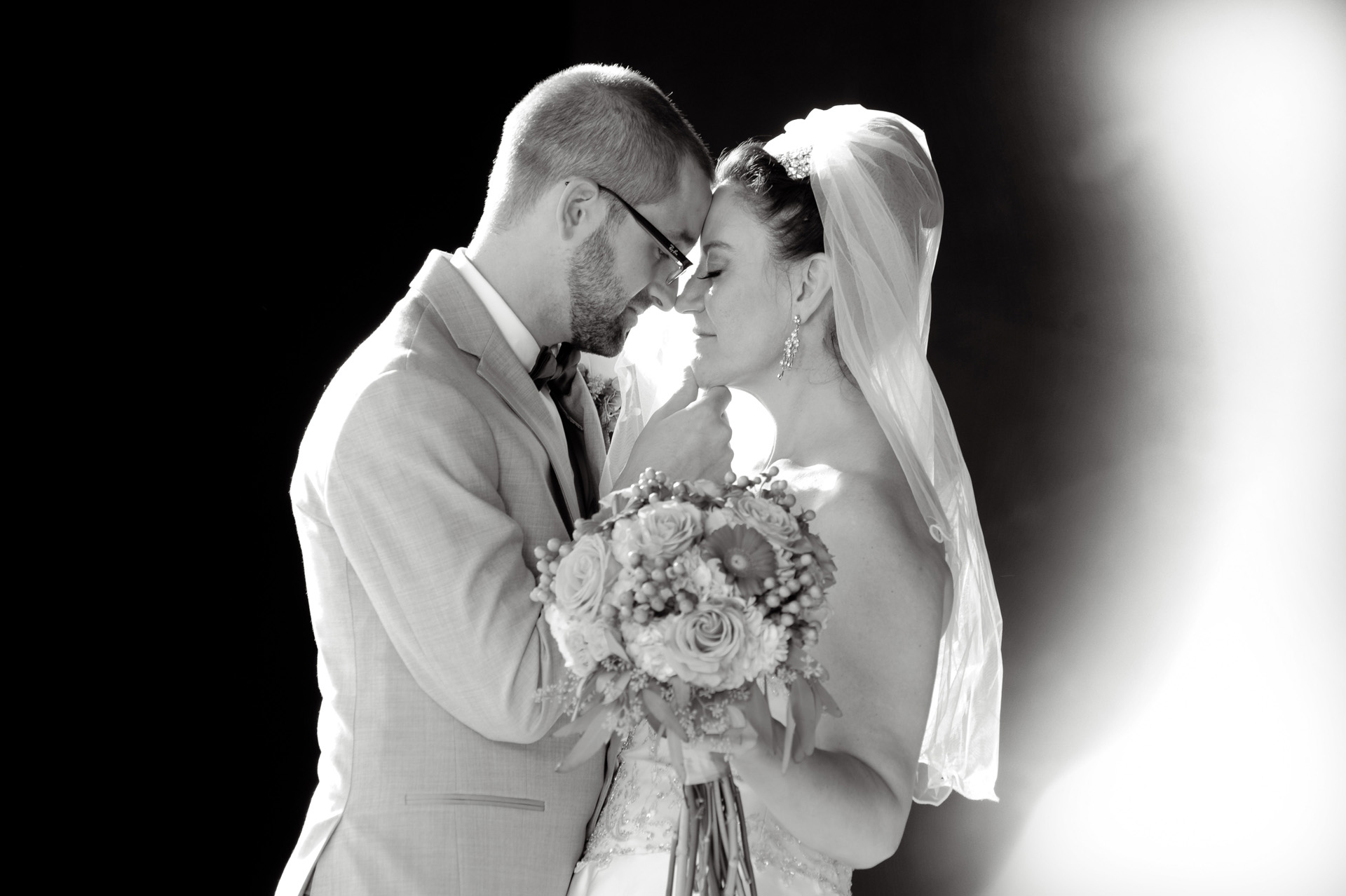 A family oriented wedding in Michigan features a bride and groom having a quiet moment before their wedding at the Wyndham Garden Hotel in Sterling Heights, Michigan (formerly known as the Sterling Inn) in Macomb County, Michigan.