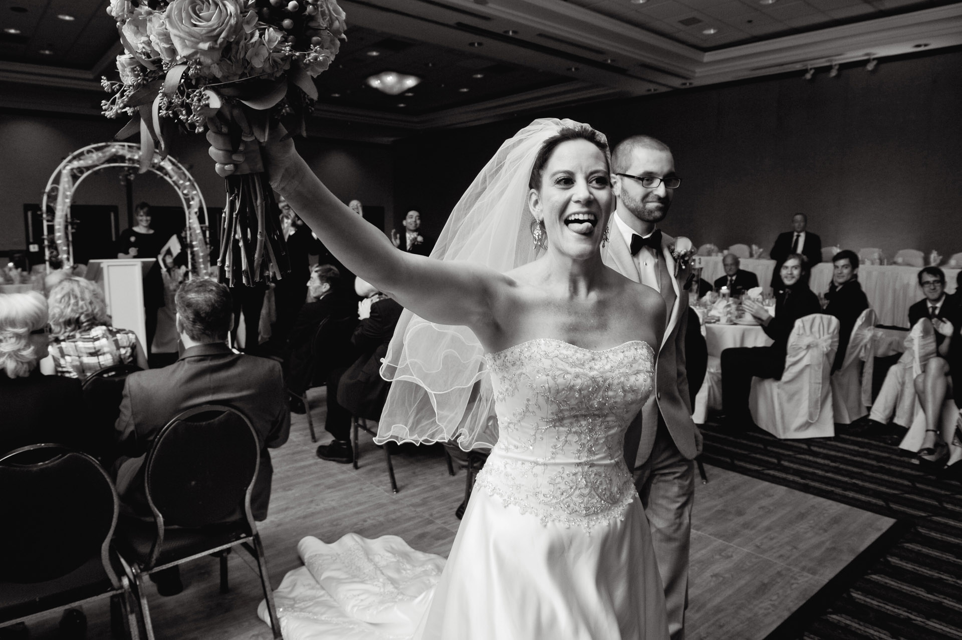 Michigan wedding in Sterling Heights, Michigan, features photos of the groom kissing the bride after their wedding at the Wyndham Garden Hotel in Sterling Heights, Michigan (formerly known as the Sterling Inn) in Macomb County, Michigan.