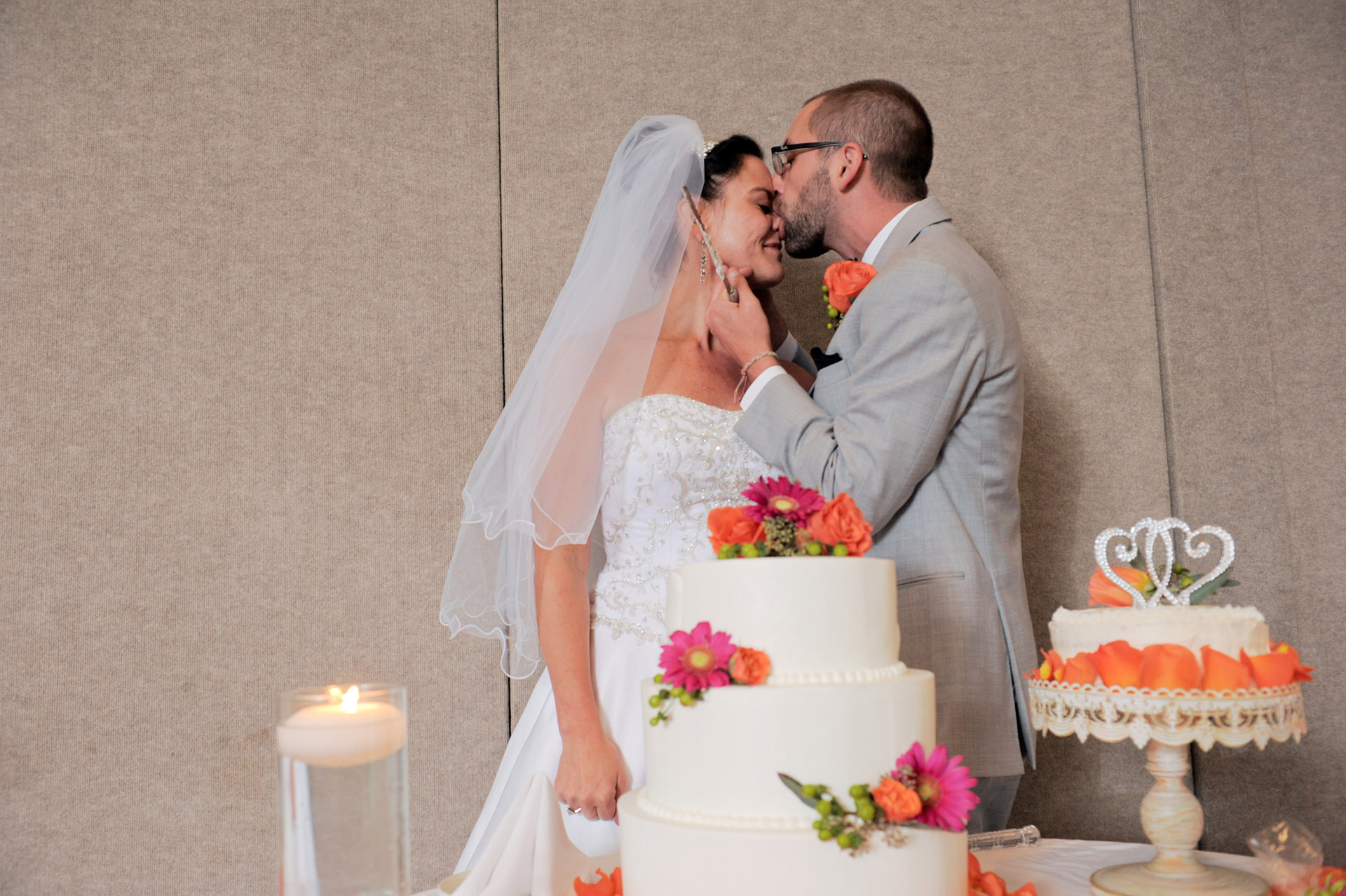 Michigan wedding at Sterling Heights, Michigan, Michigan wedding shows a photograph of the groom wiping frosting on his wife's nose during the wedding reception at the Wyndham Garden Hotel in Sterling Heights, Michigan (formerly known as the Sterling Inn) in Macomb County, Michigan.