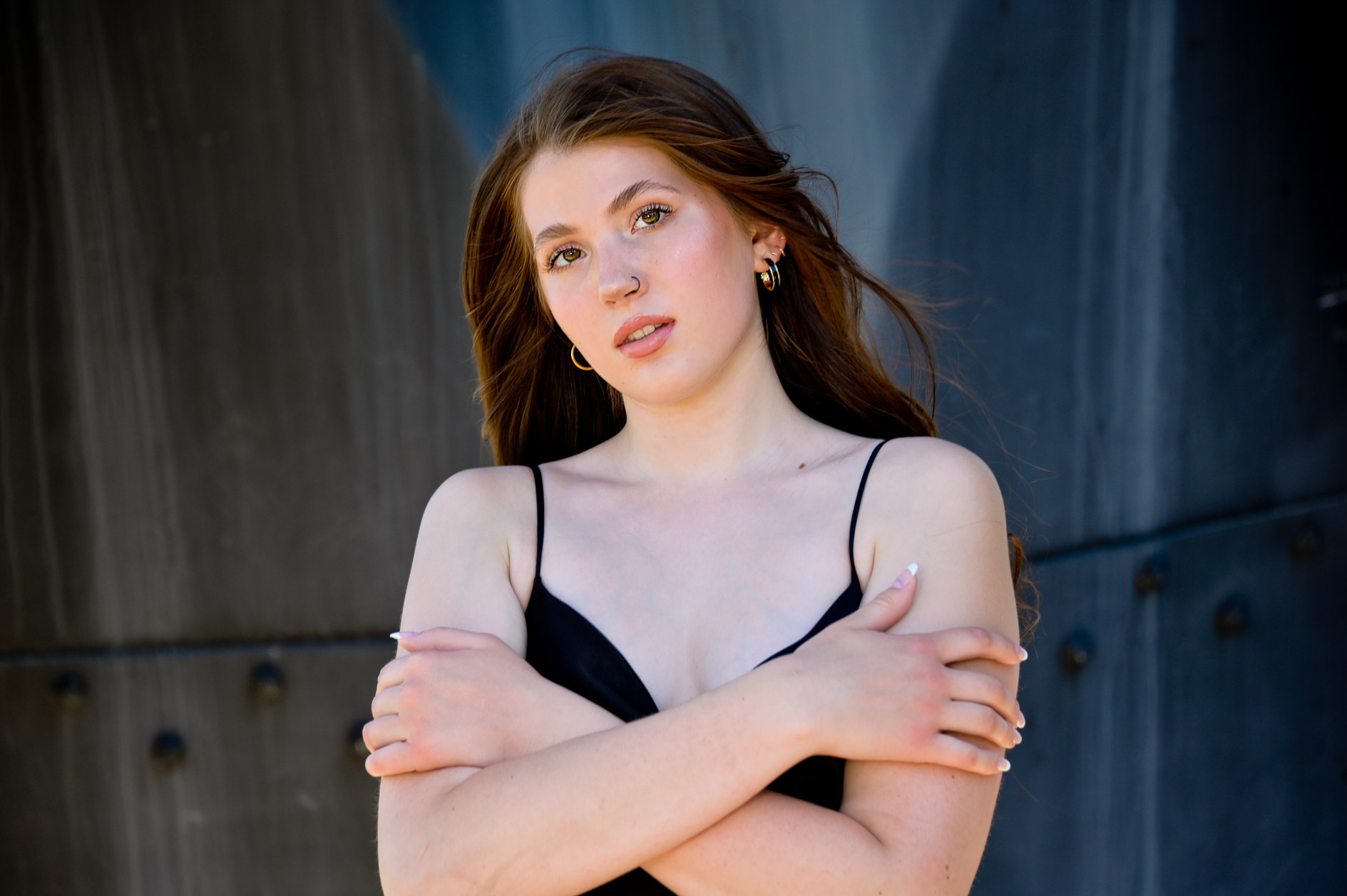 Side by side images showing different moods and feelings of a Fraser High School senior having her photography taken in Detroit.