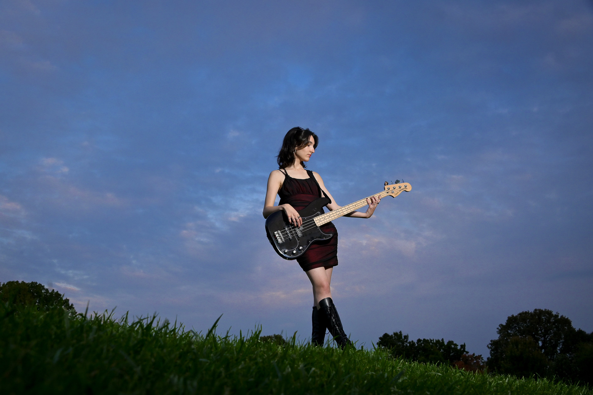 IA high school senior poses with her electric base in Rochester, Michigan.