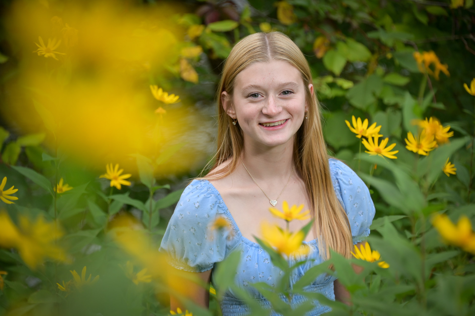 A Troy High senior is photographed in a field of flowers near Rochester, Michigan.