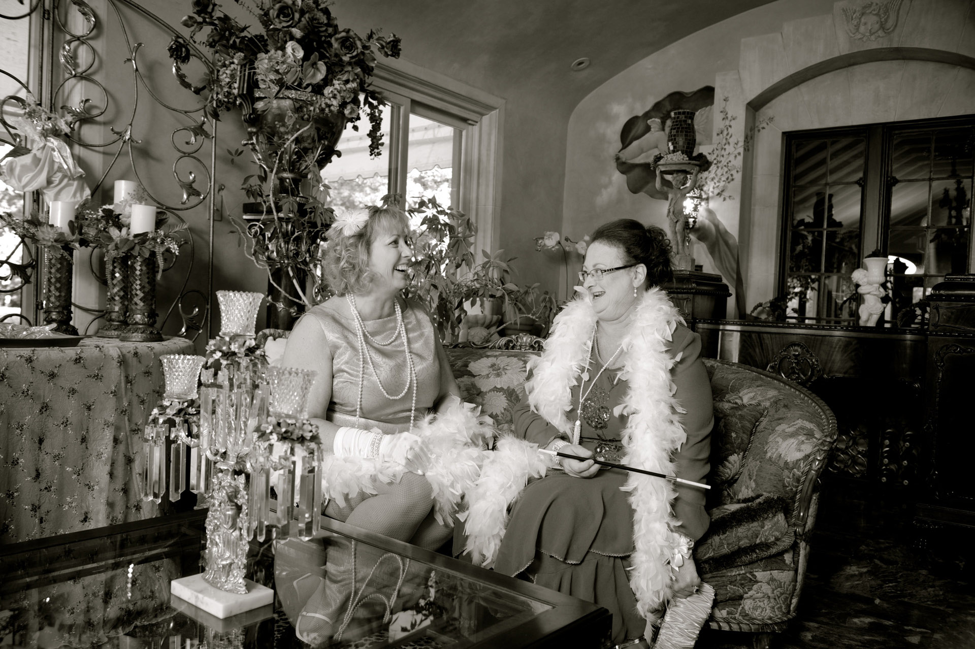 Michigan wedding at Birmingham, featured a trip to a turn of the century mansion nearby where the mothers of the bride and groom pose for an old fashioned portrait at their 1920's themed wedding int Birmingham, Michigan's Big Rock's wedding venue The Reserve.