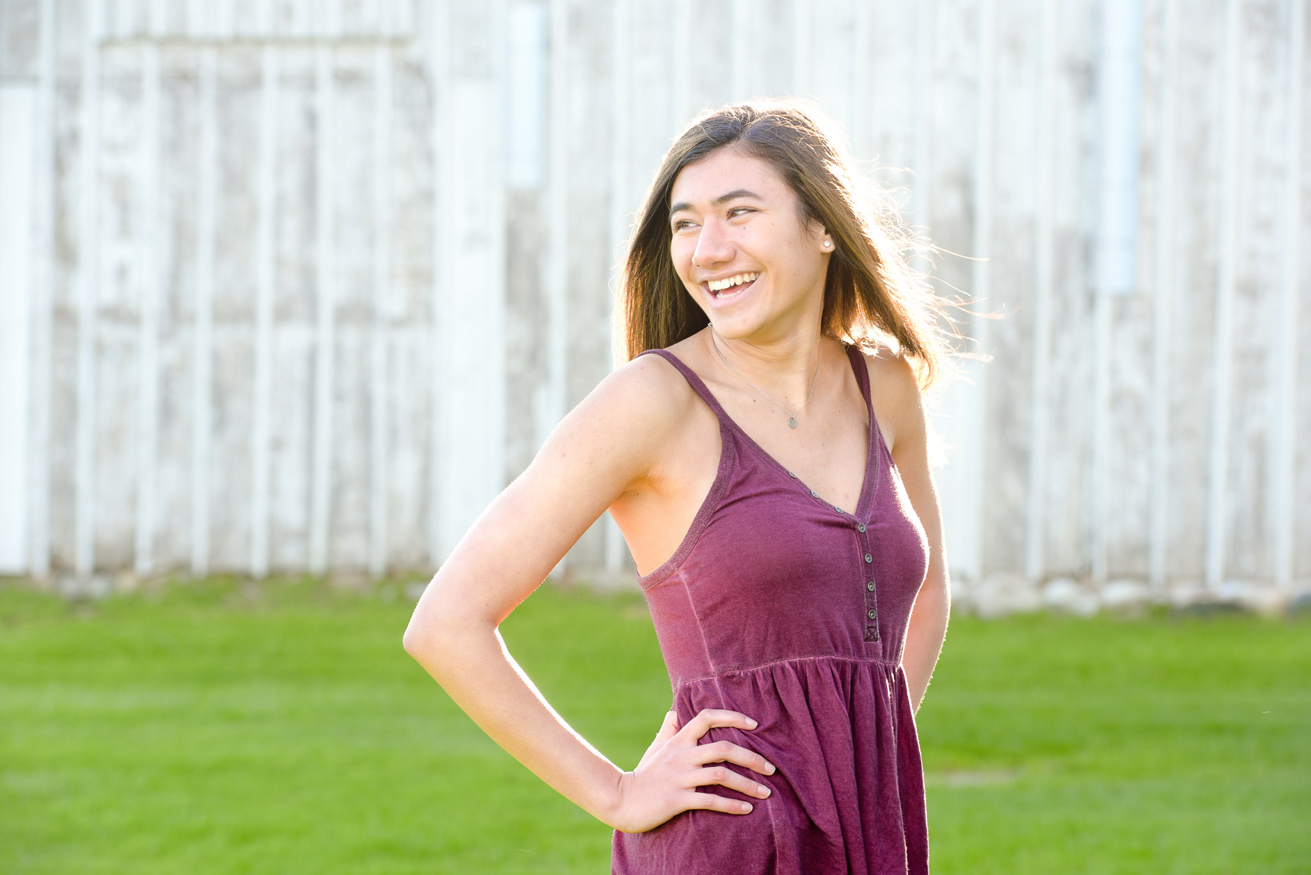 Troy , Michigan high school senior pictures photo laughing during her senior picture session in Troy, Michigan.